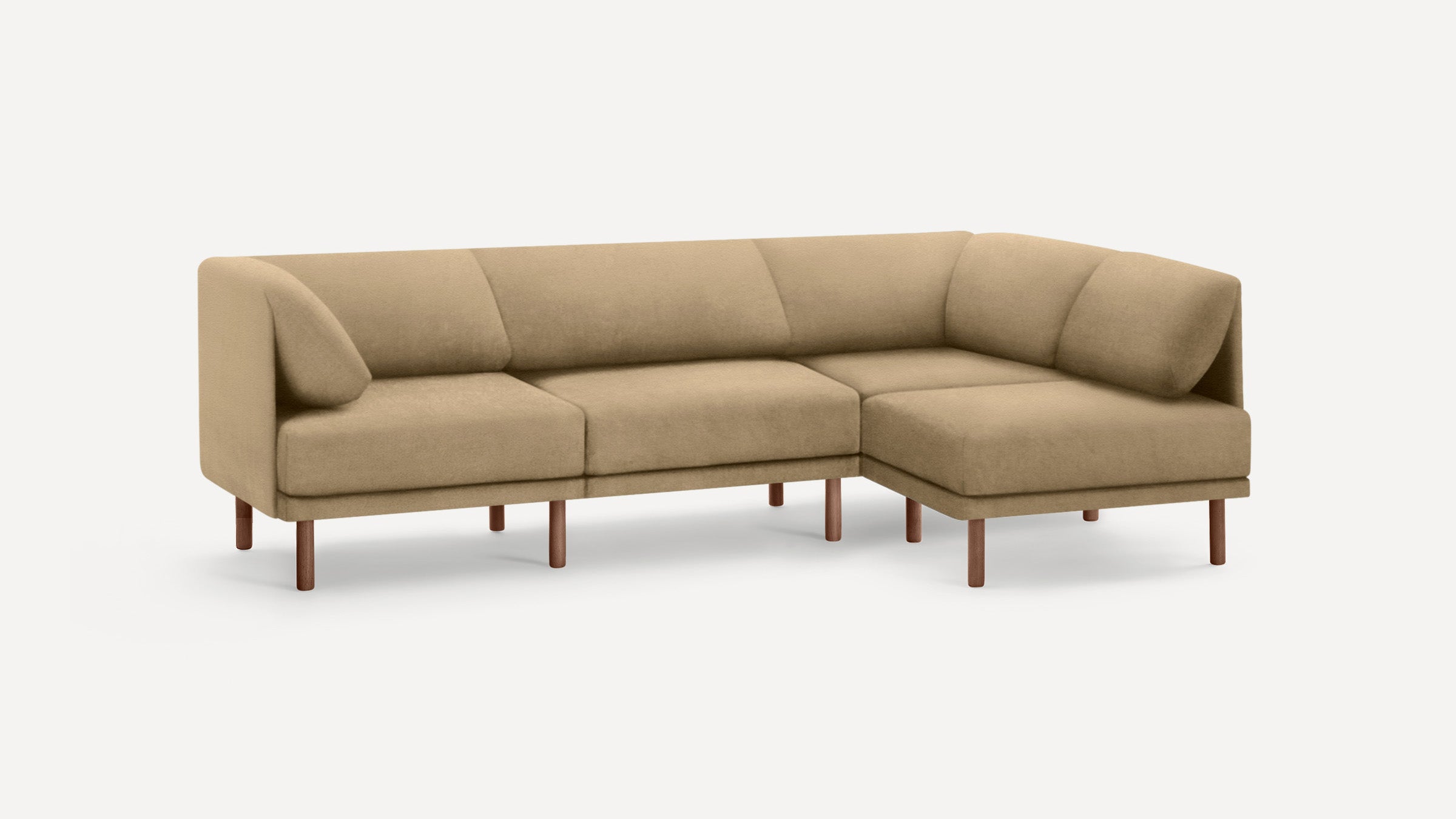 Beige sectional sofa with rounded cushions and wooden legs, featuring a right-side chaise lounge on a plain white background.