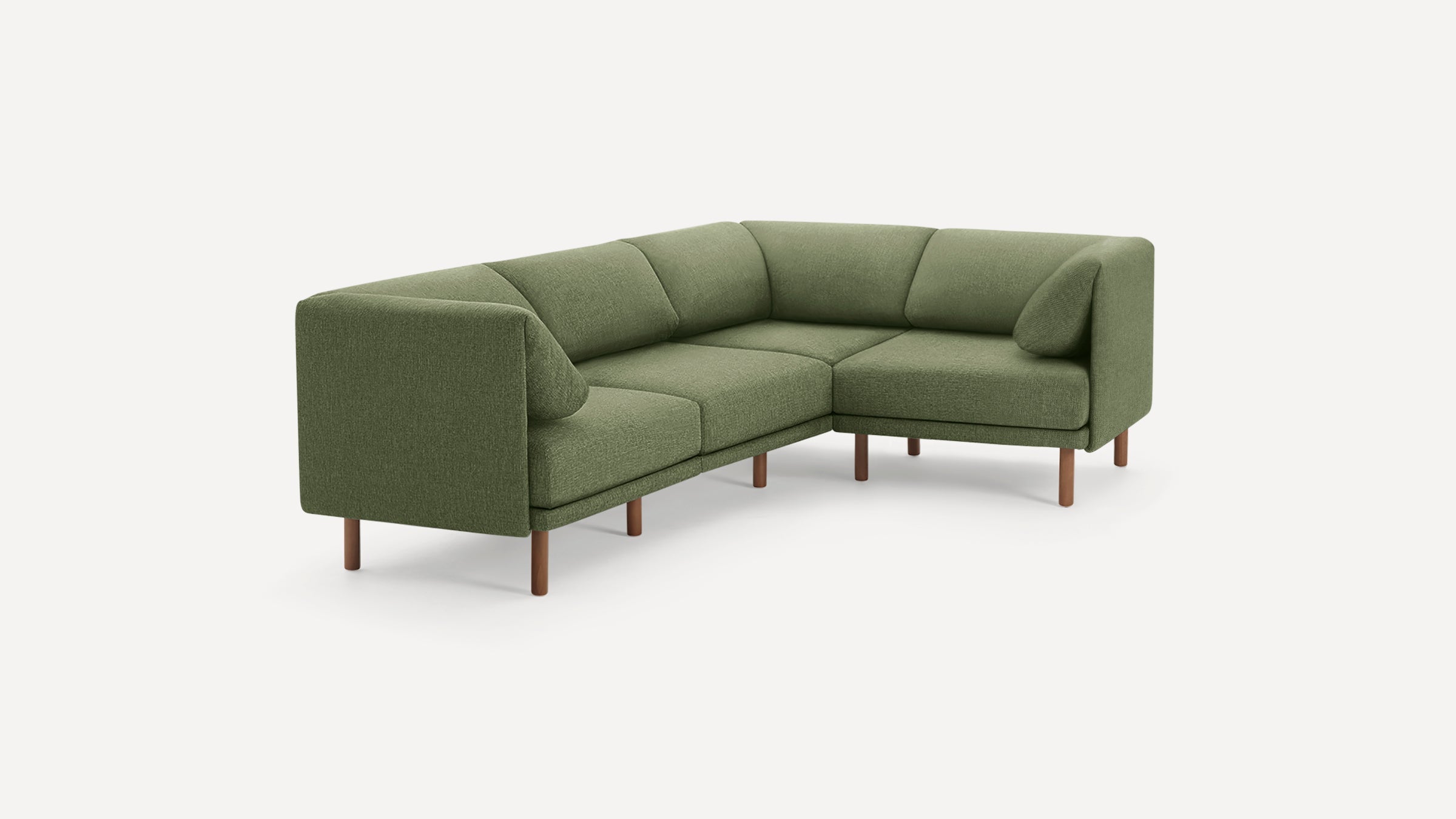 Green L-shaped modern fabric sofa with clean lines and wooden legs on a white background.