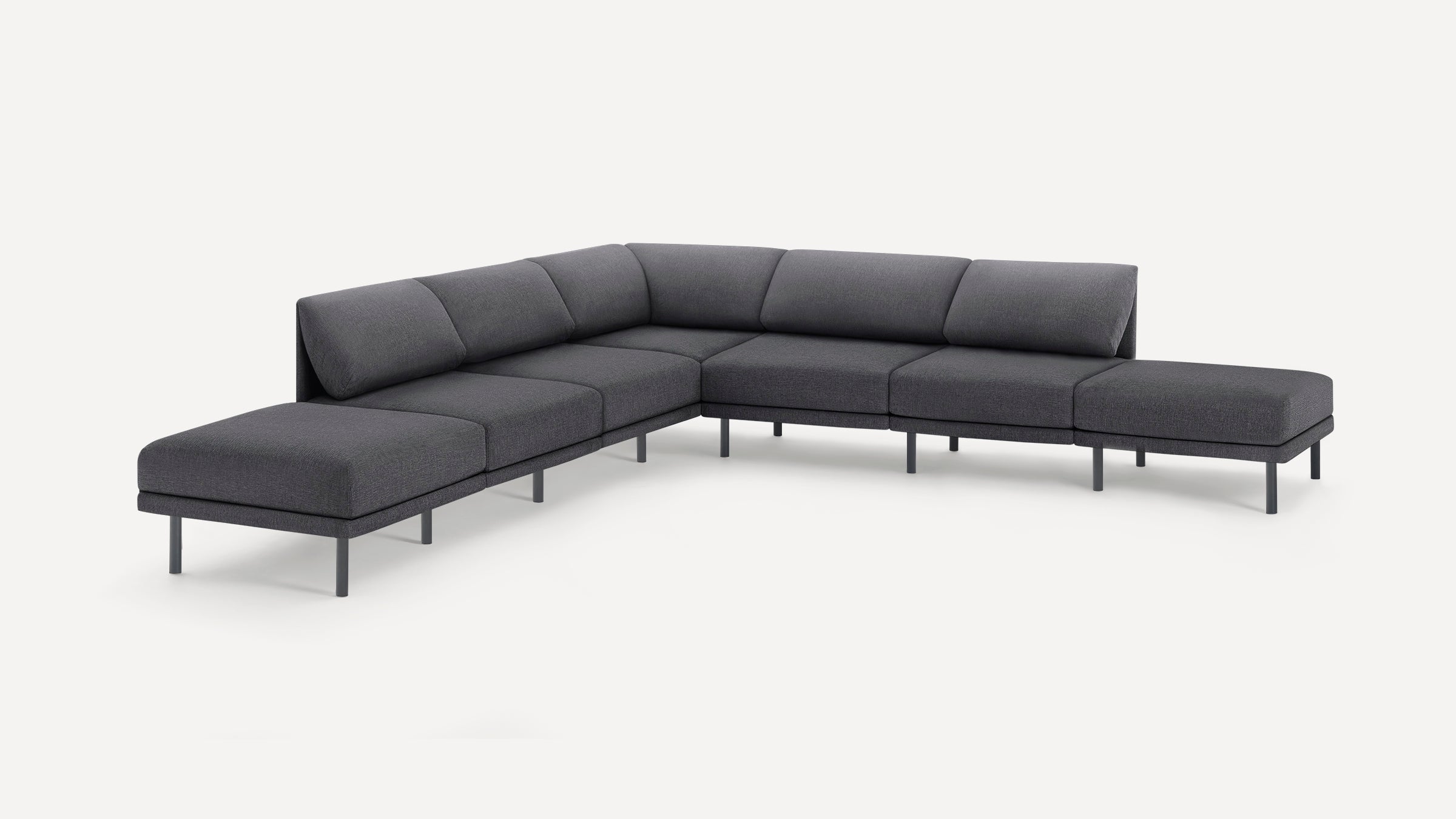 Modern L-shaped sectional sofa with dark gray fabric upholstery and slim metal legs on a white background.