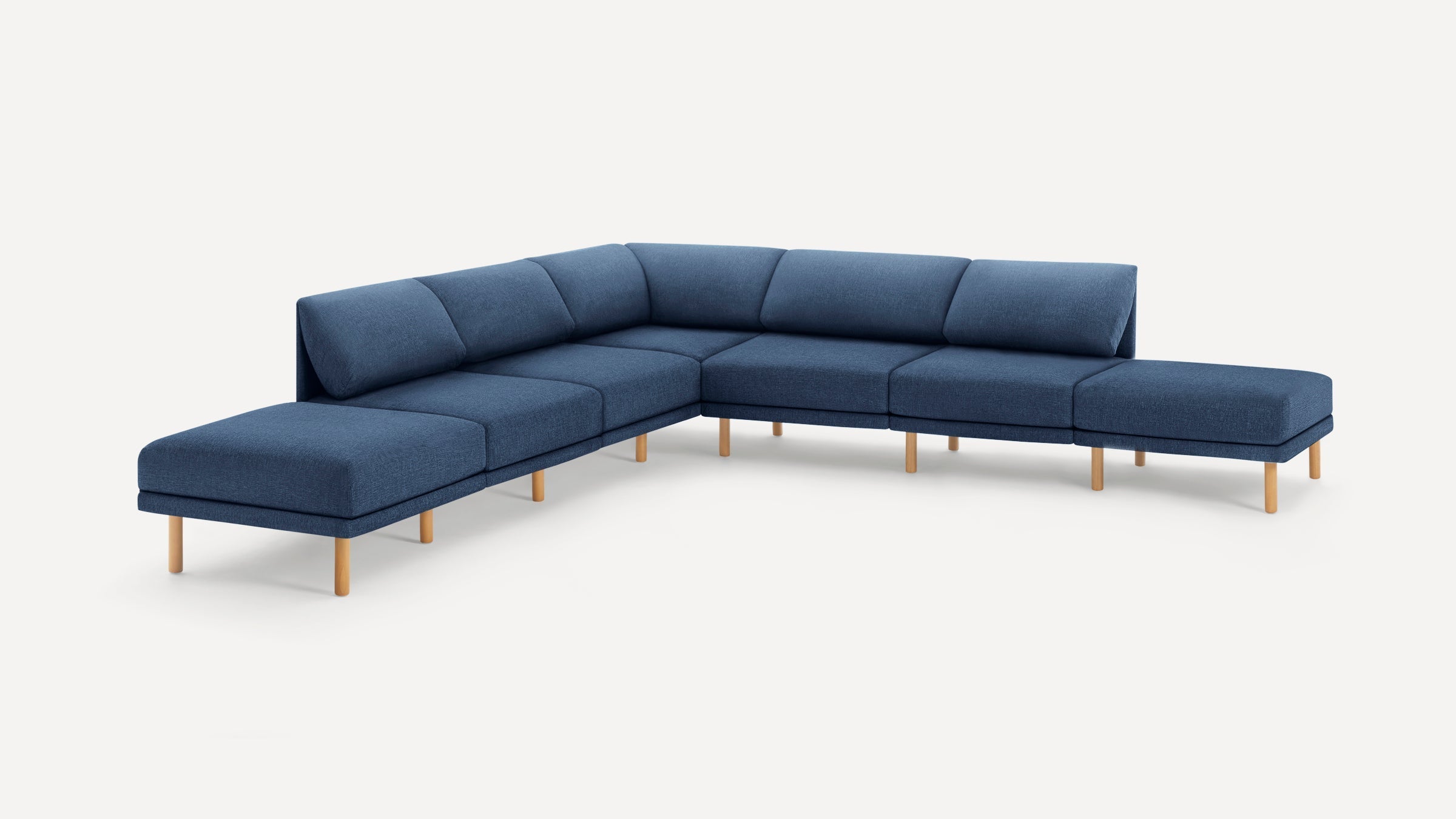 Modern L-shaped sectional sofa with blue fabric upholstery and wooden legs on a white background.