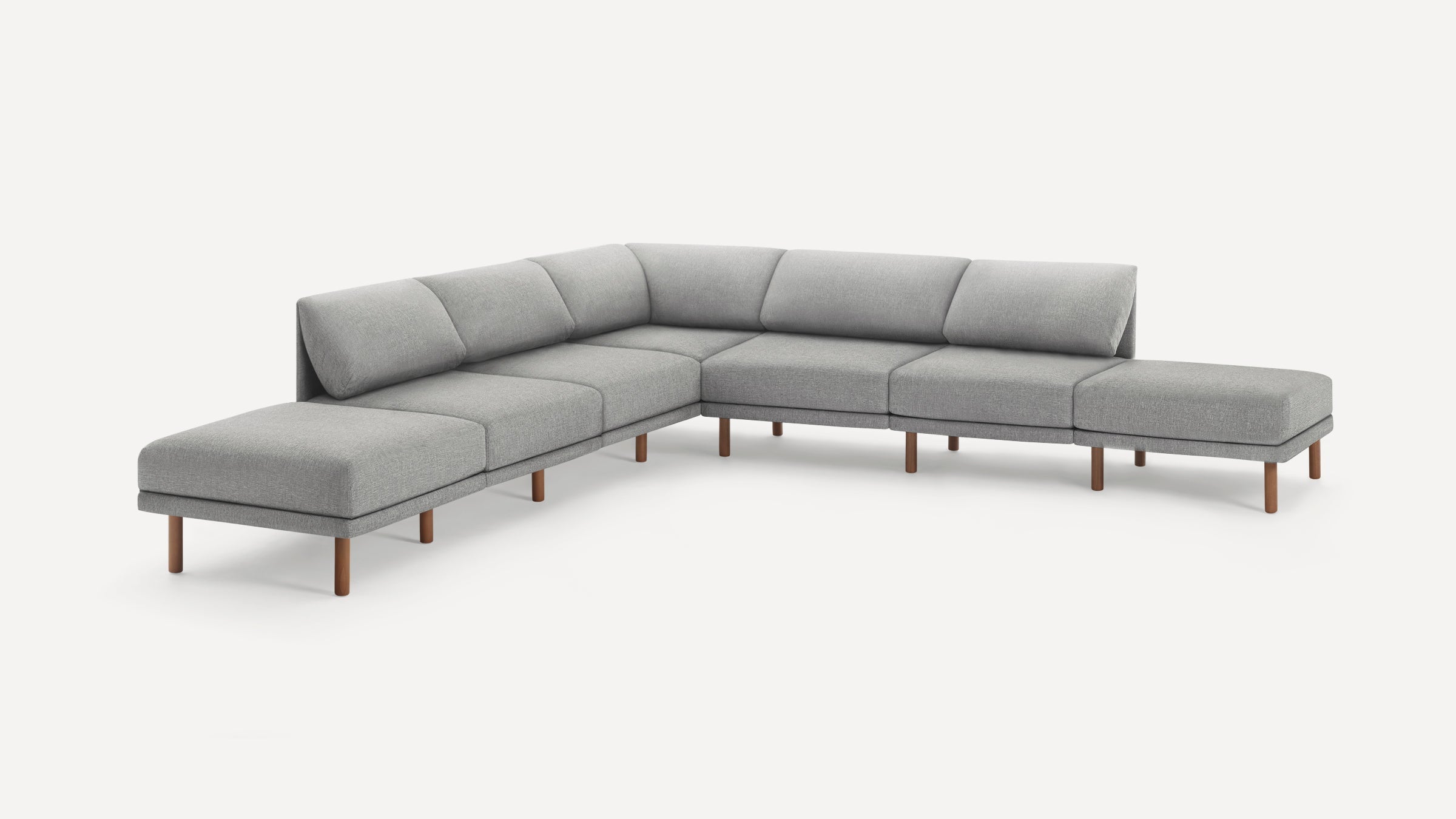 Modern L-shaped sectional sofa with light gray fabric upholstery and wooden legs on a white background.