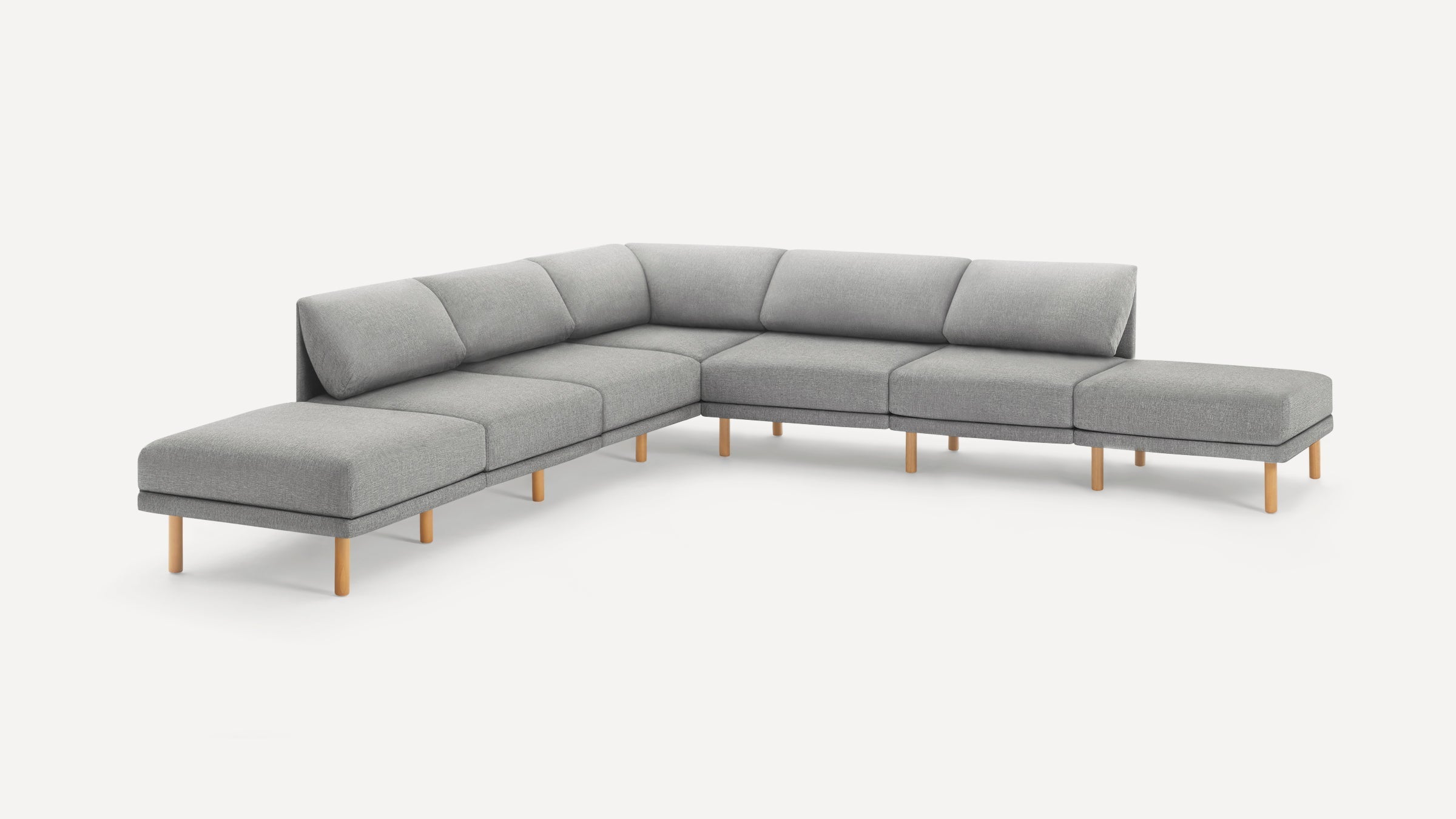 Modern light gray fabric sectional sofa with wooden legs and an L-shaped design, featuring cushioned backrests and seats.