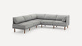 Modern L-shaped sectional sofa in light gray fabric with wooden legs, featuring cushioned seats and backrests.