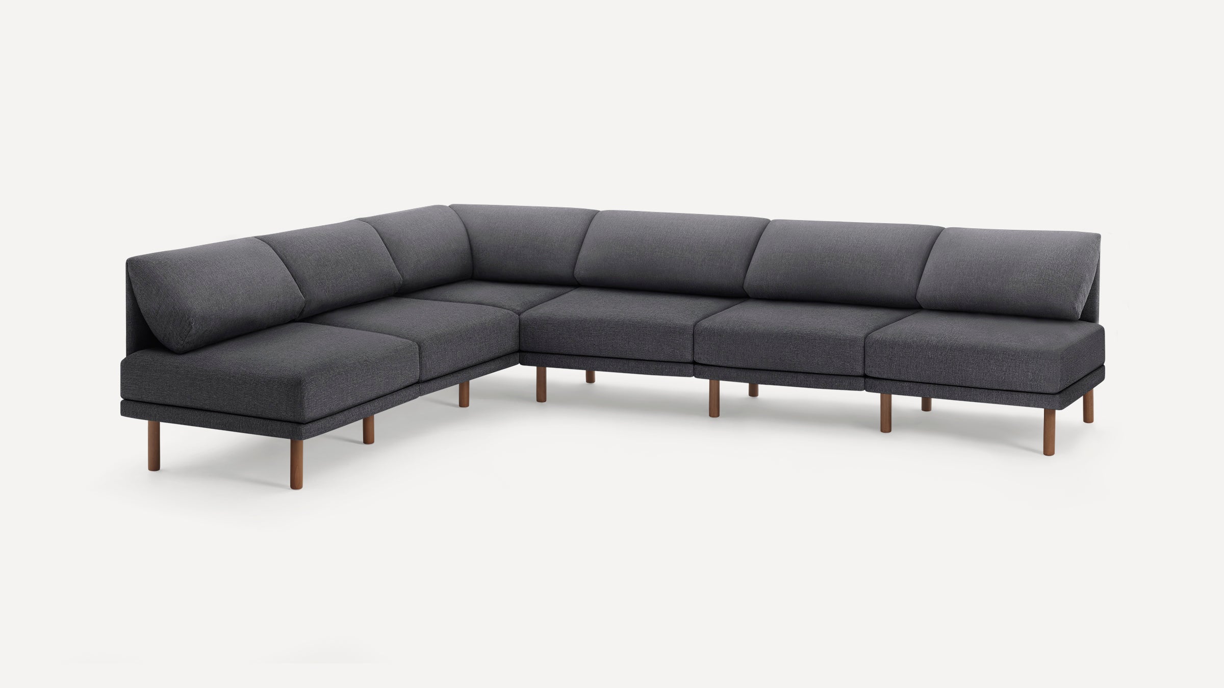Dark gray modern sectional sofa with wooden legs, L-shaped design, and cushioned backrests on a white background.