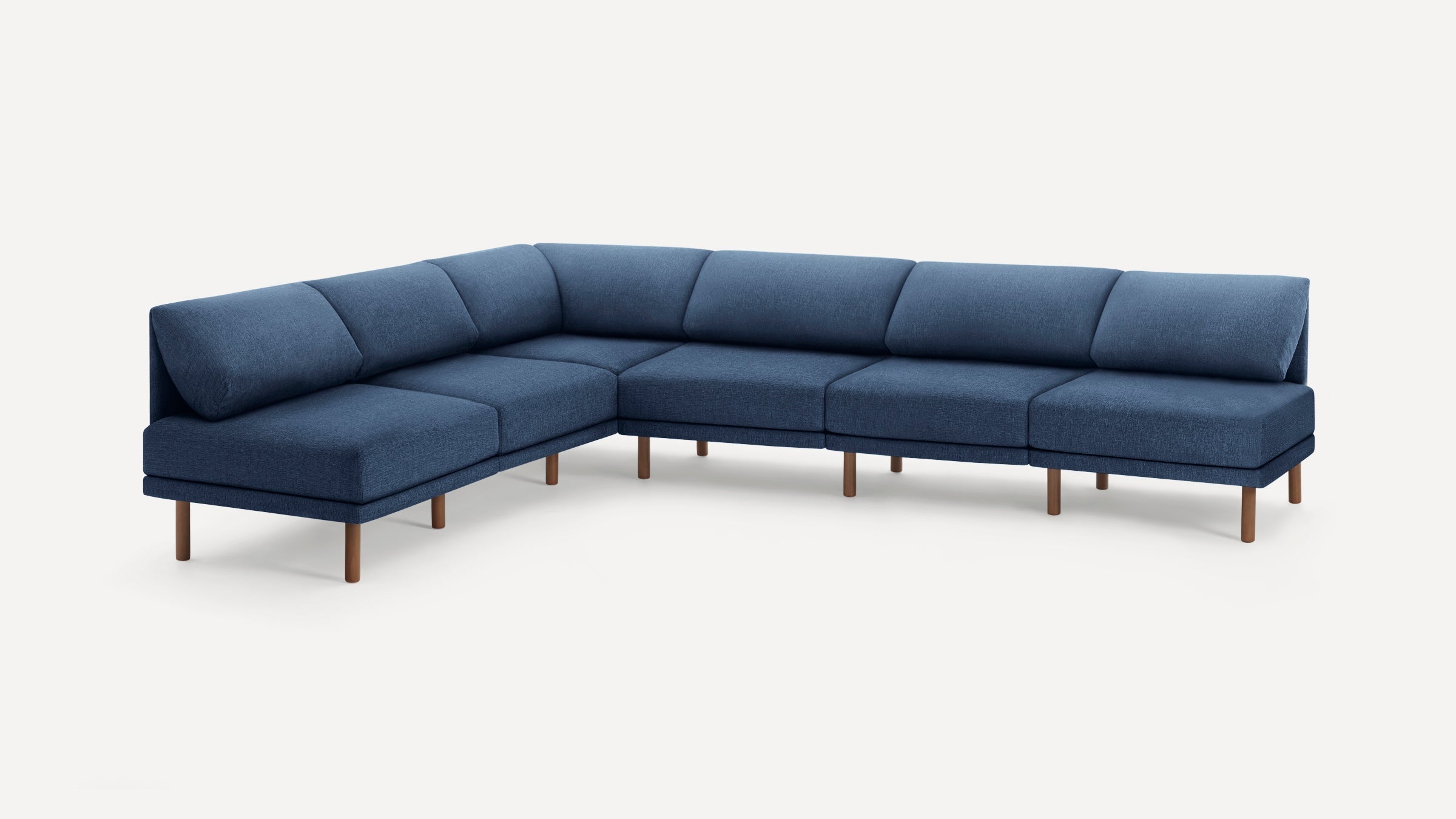Large modern blue fabric sectional sofa with wooden legs, featuring a right-angle corner design and cushioned backrests.