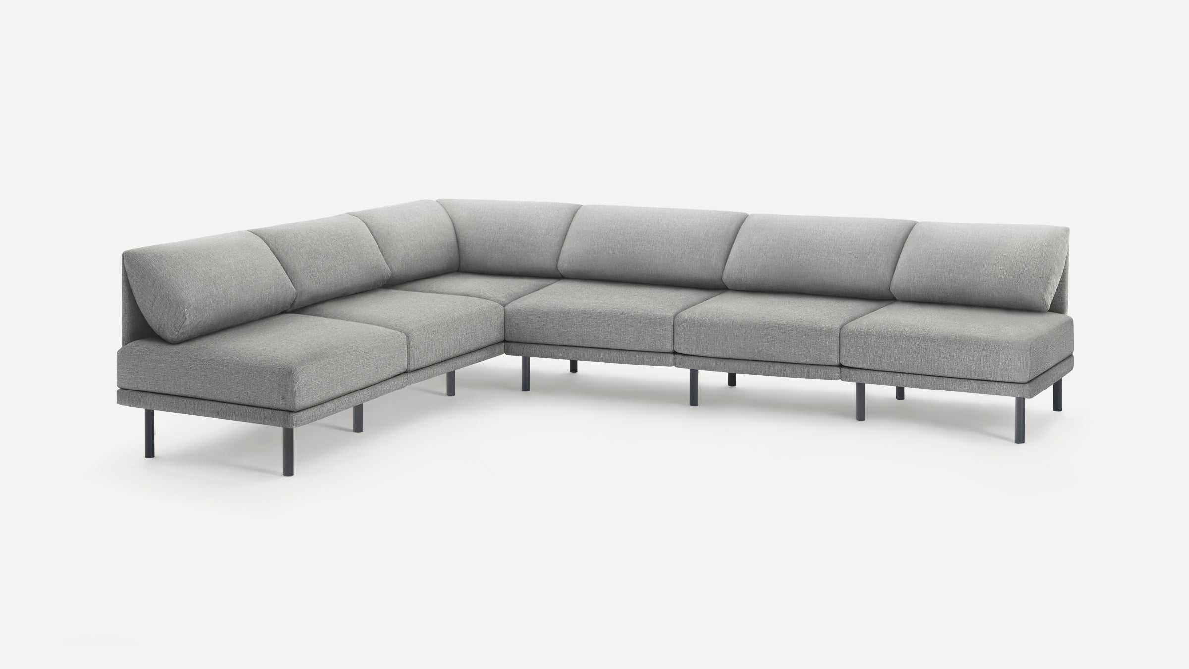 Modern L-shaped sectional sofa with light gray fabric upholstery and slim black metal legs on white background.