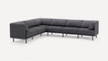 Dark gray modern L-shaped sectional sofa with slim metal legs and angled cushions on a white background.