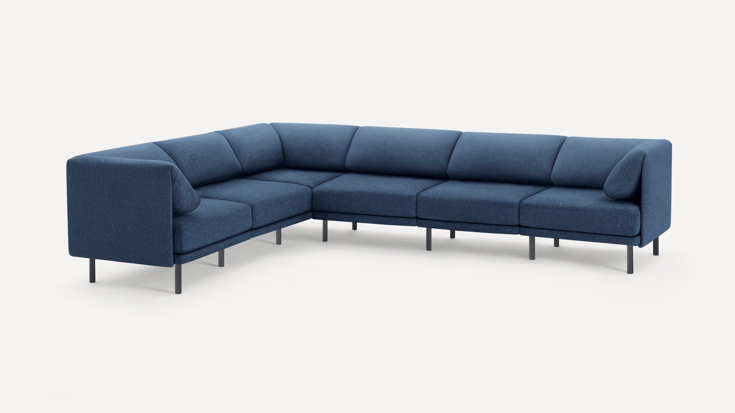 Modern L-shaped sectional sofa with deep blue fabric upholstery and slim black metal legs, featuring cushioned seats and backrests.