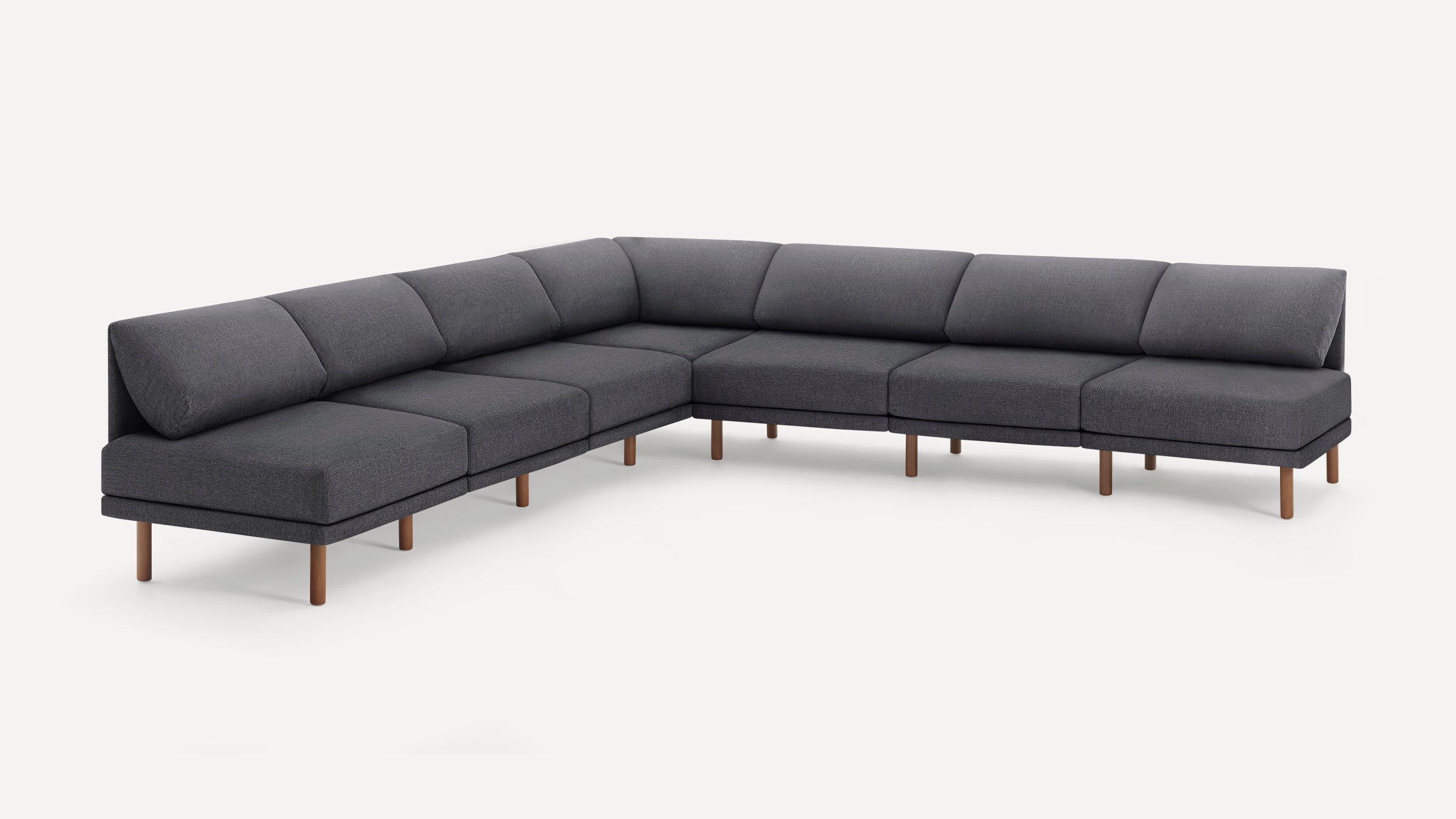 Dark gray modern L-shaped sectional sofa with wooden legs, clean lines, and plush cushioned backrests on a white background.