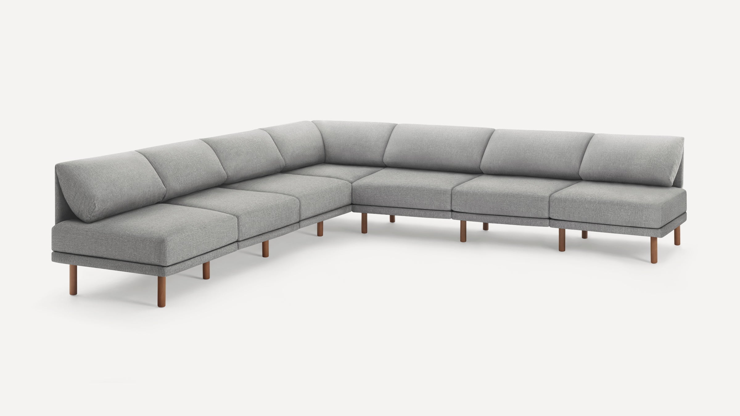 Modern L-shaped sectional sofa in light gray fabric with wooden legs, featuring clean lines and minimalist design.