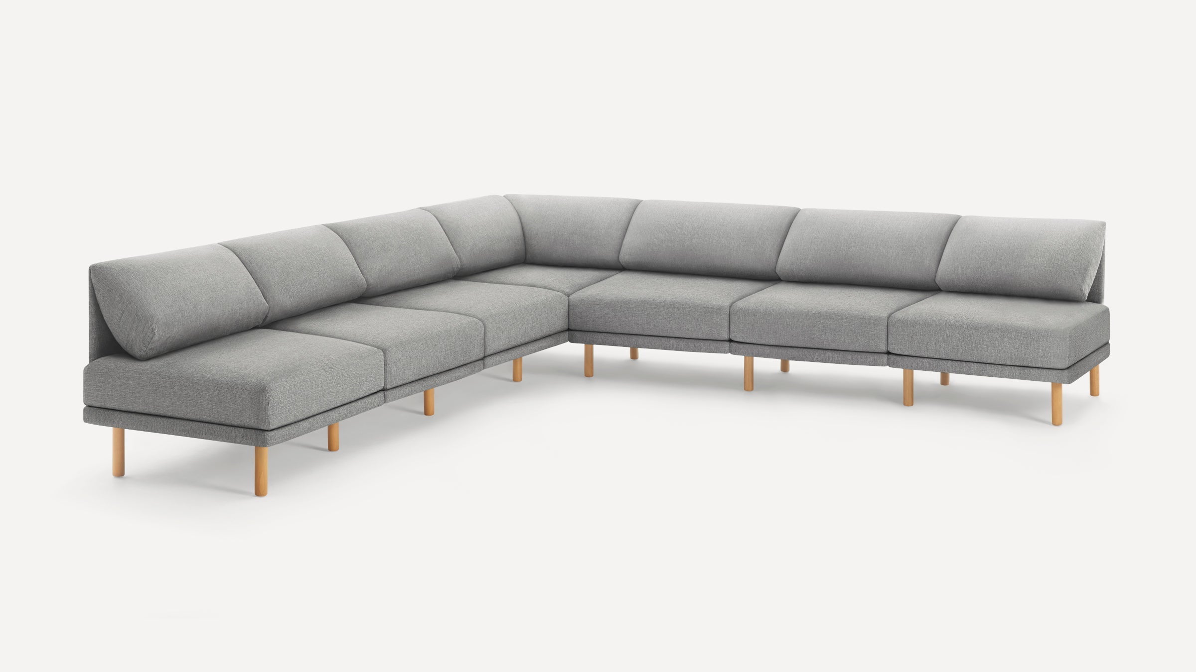 Modern L-shaped sectional sofa with light gray fabric upholstery and natural wooden legs on a white background.