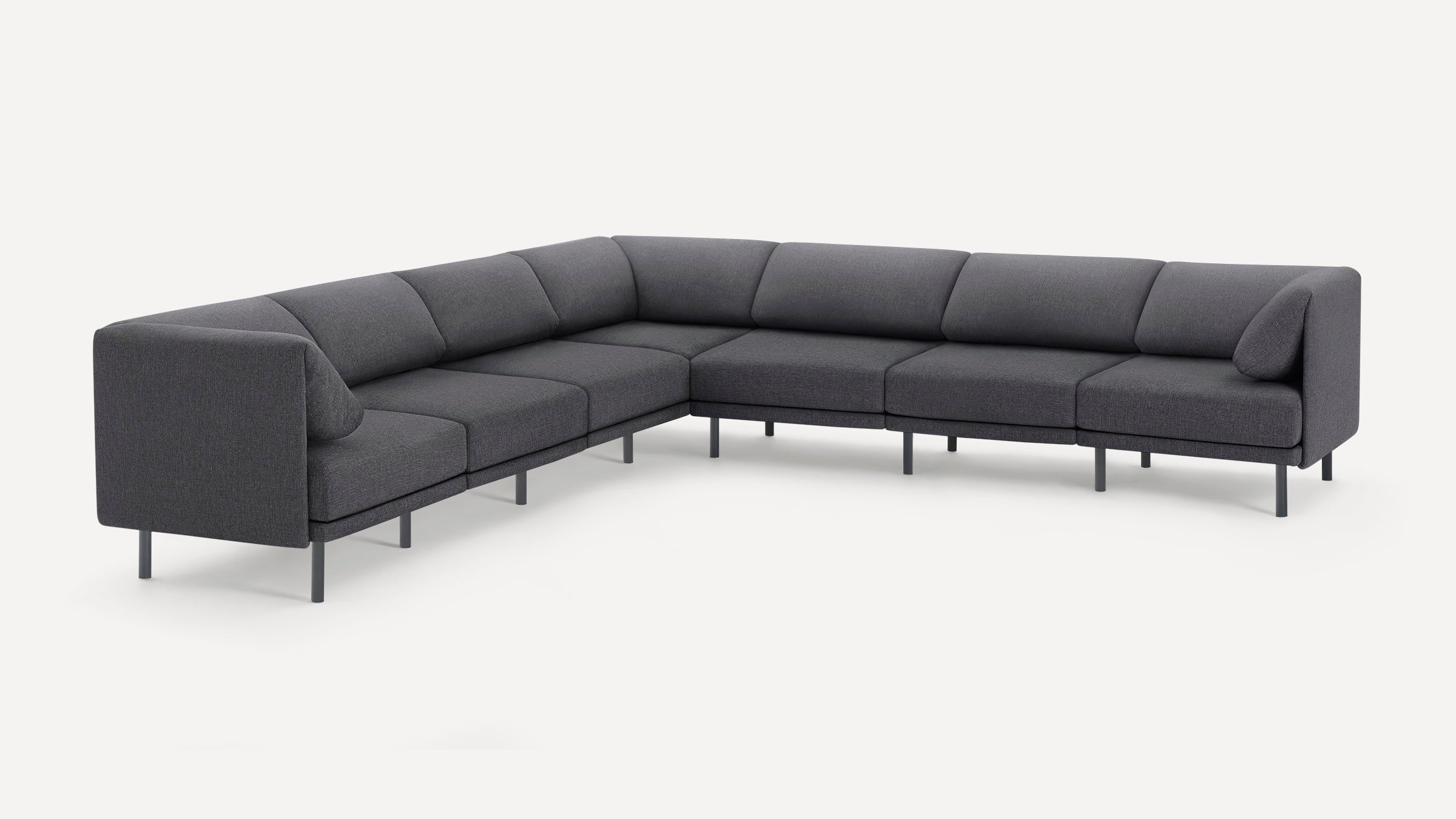 Modern dark gray fabric sectional sofa with clean lines, metal legs, and plush cushions arranged in an L-shape.