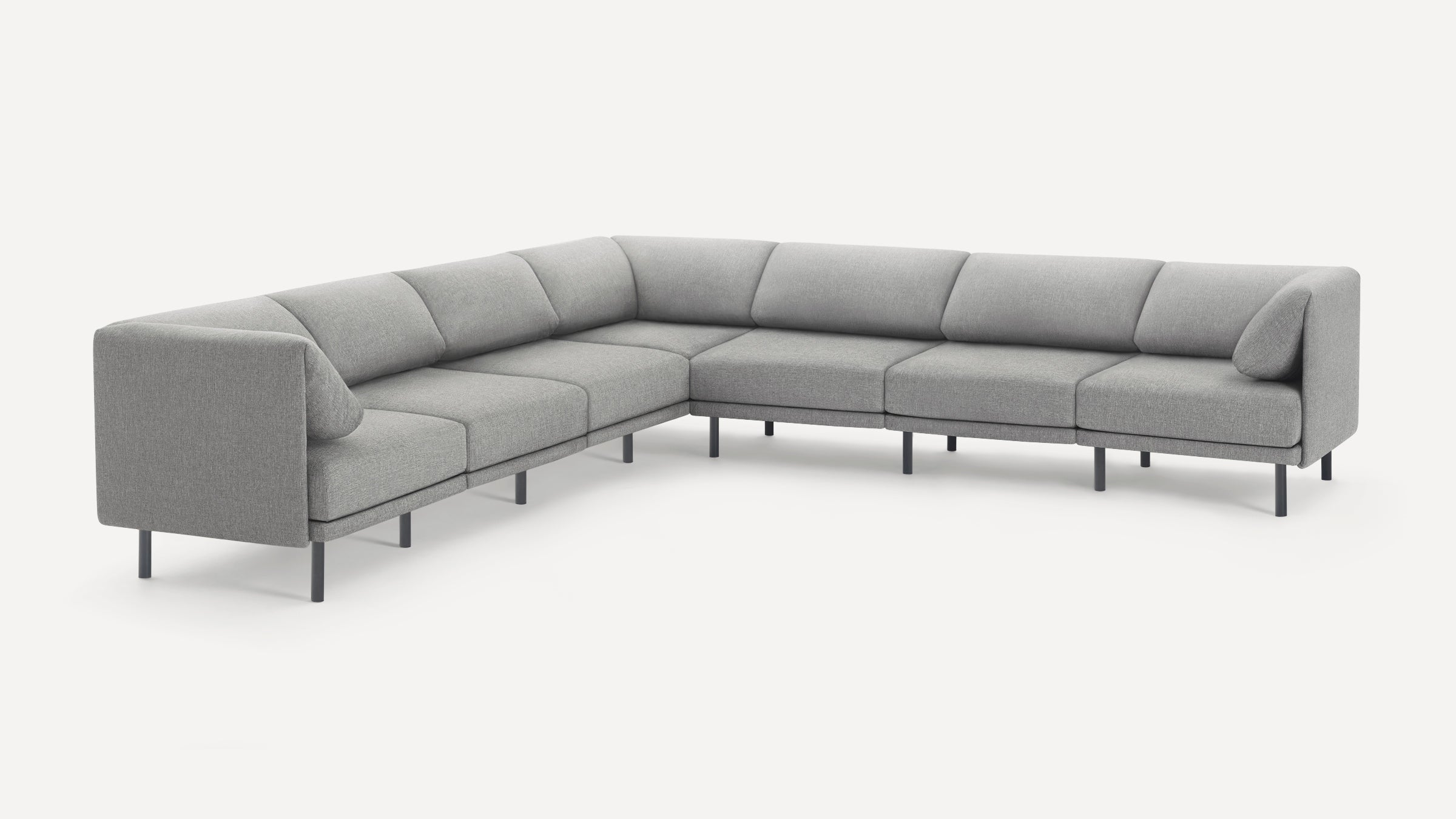 Modern L-shaped sectional sofa with grey fabric upholstery and slim black metal legs, featuring clean lines and minimalistic design.