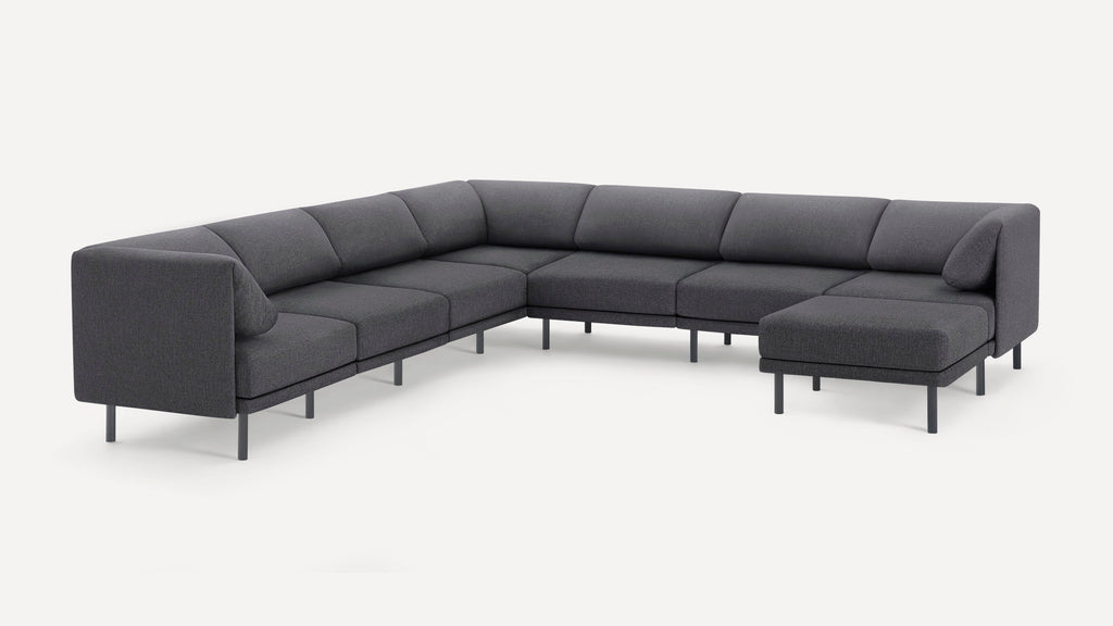 Modern dark gray fabric sectional sofa with clean lines, metal legs, and an L-shaped configuration for spacious seating.