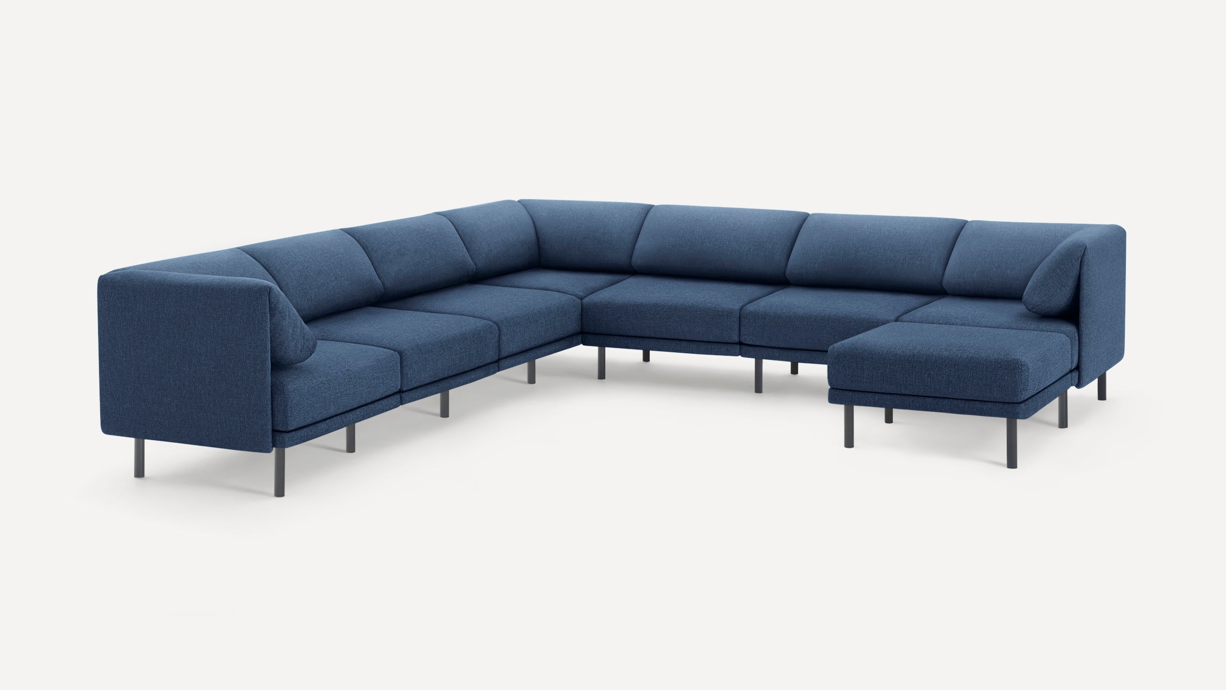 Modern U-shaped sectional sofa in dark blue fabric with clean lines and slim black metal legs on a white background.