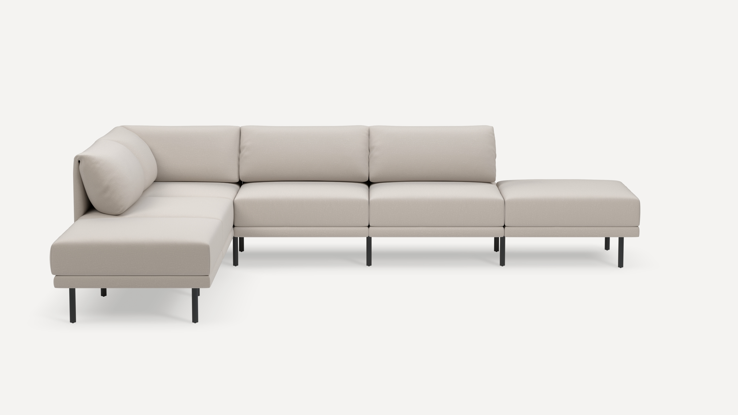 Modern light beige L-shaped sectional sofa with slim black metal legs and thick cushions, offering ample seating space.