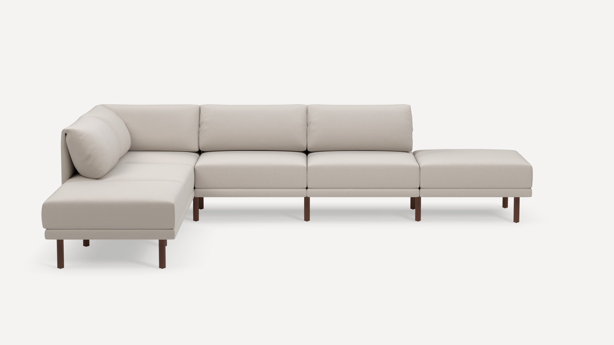 Modern L-shaped sectional sofa with light beige fabric upholstery and dark wooden legs, featuring plush cushions for comfort.