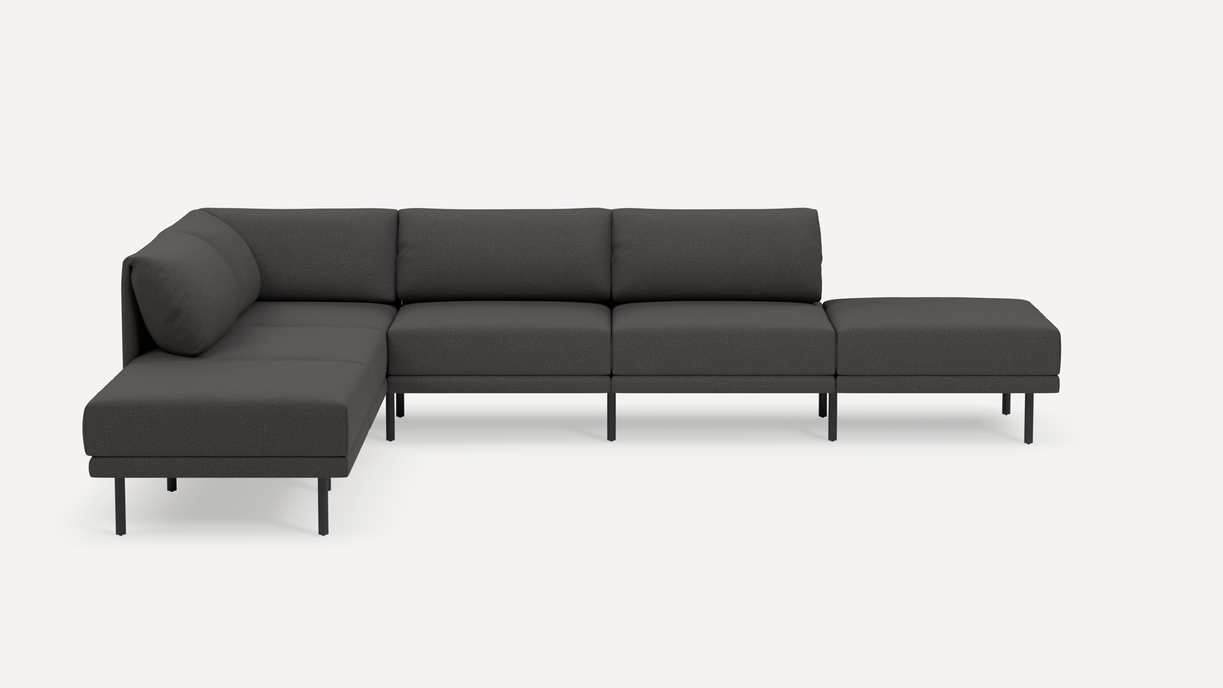Modern dark gray L-shaped sectional sofa with minimalist black metal legs and plush cushions on a white background.
