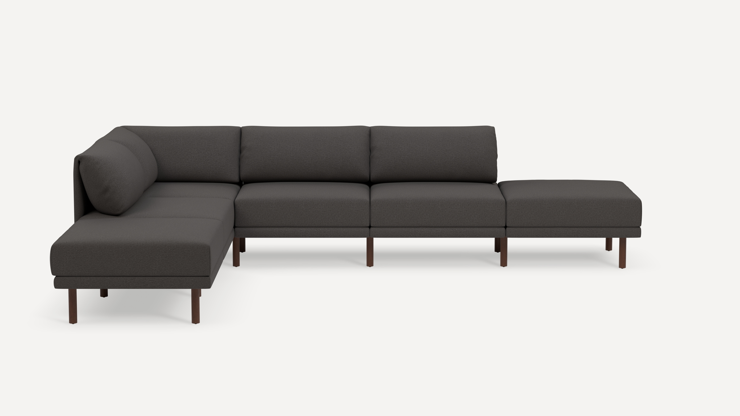 Modern L-shaped sectional sofa with dark gray fabric upholstery and slender wooden legs, featuring cushioned backrests and seats.