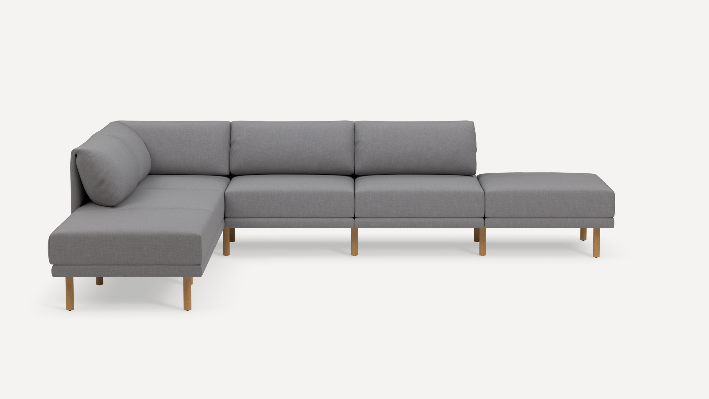 Modern L-shaped sectional sofa with light gray fabric upholstery and light wooden legs on a white background.