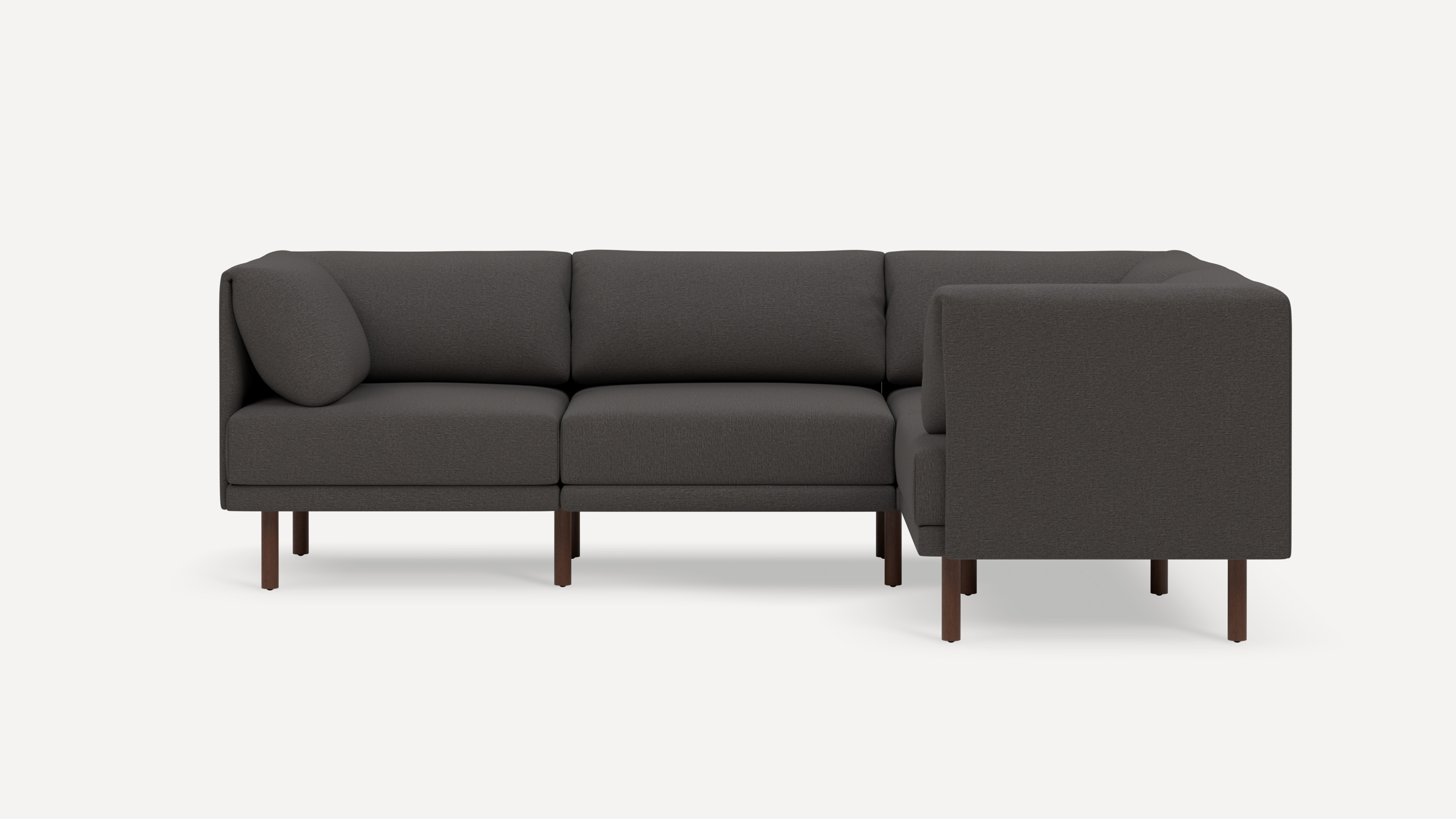L-shaped modern dark gray sectional sofa with wooden legs and plush cushions, shown against a white background.