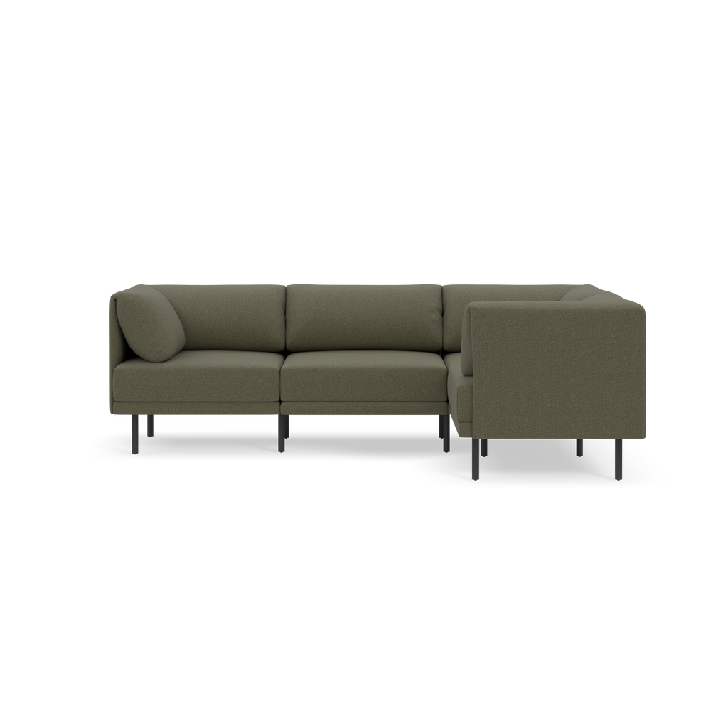 Modern L-shaped sectional sofa in Moss green fabric with slim black metal legs and plush cushions, including a round pillow.