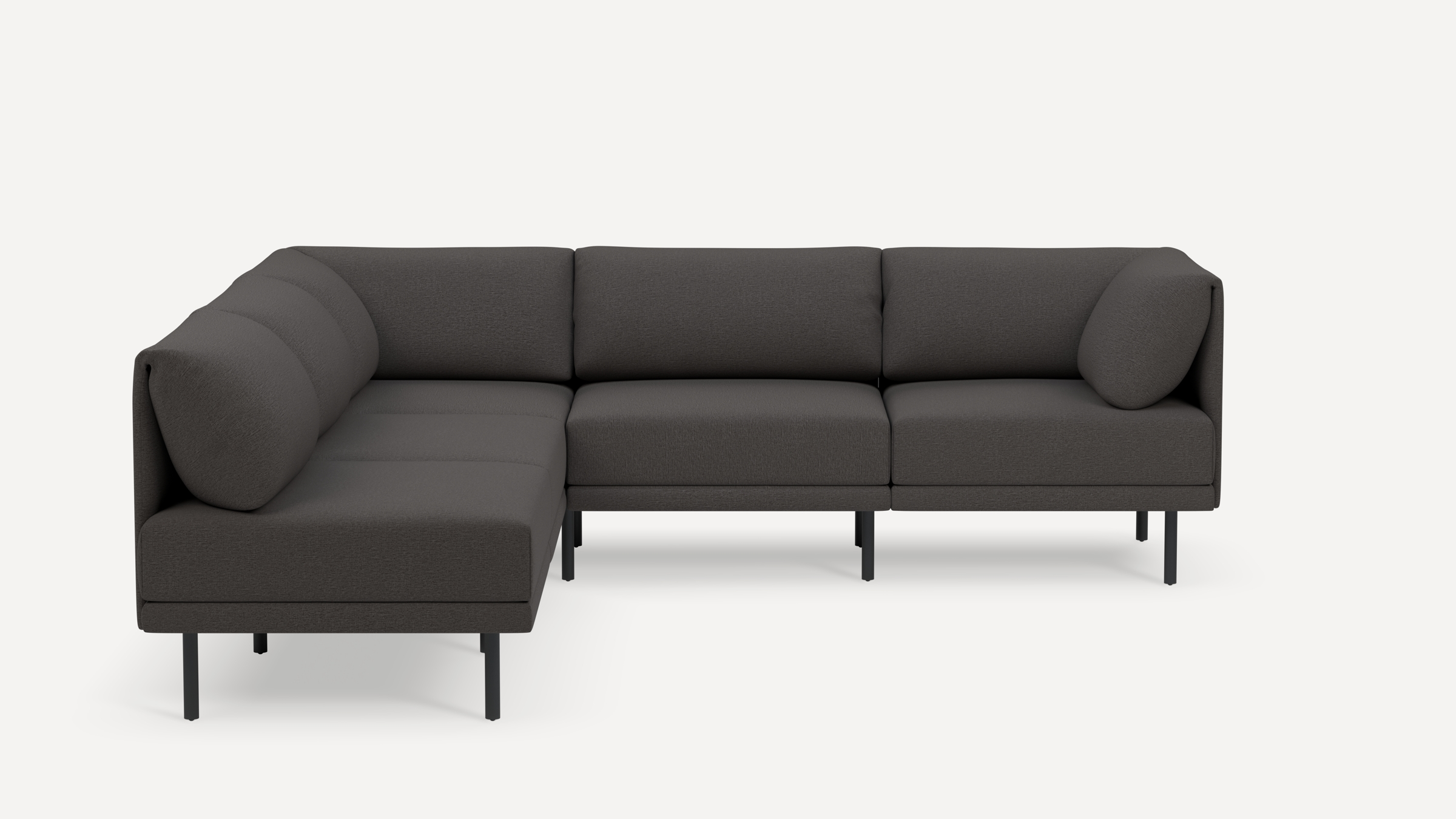 Modern dark gray L-shaped sectional sofa with cushioned backrests and slim black metal legs, minimalist design.