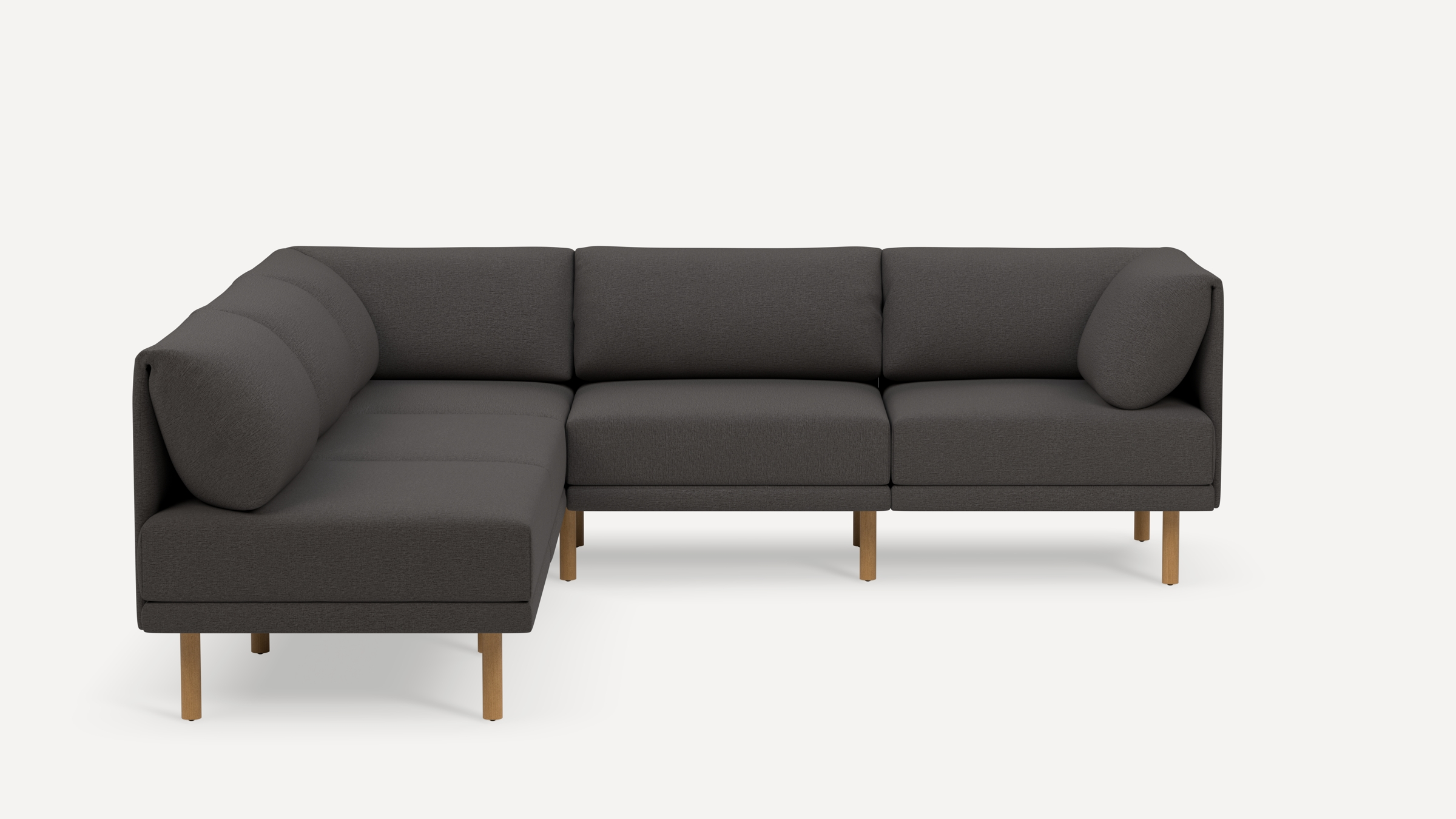 Dark gray L-shaped sectional sofa with clean lines, padded back cushions, and wooden legs on a white background.