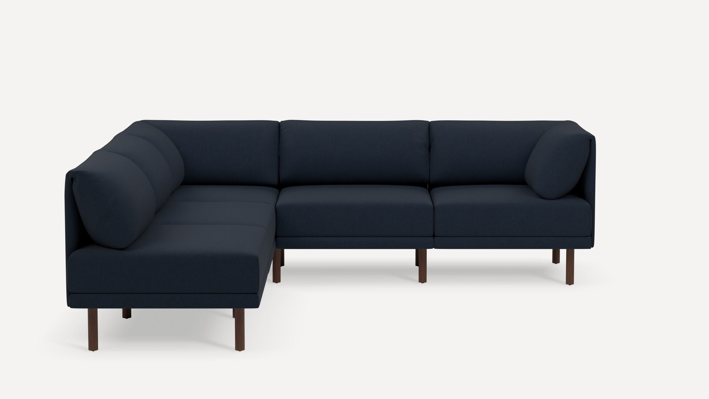 Modern navy blue fabric sectional sofa with clean lines, wooden legs, and cushioned backrests in an L-shaped design.
