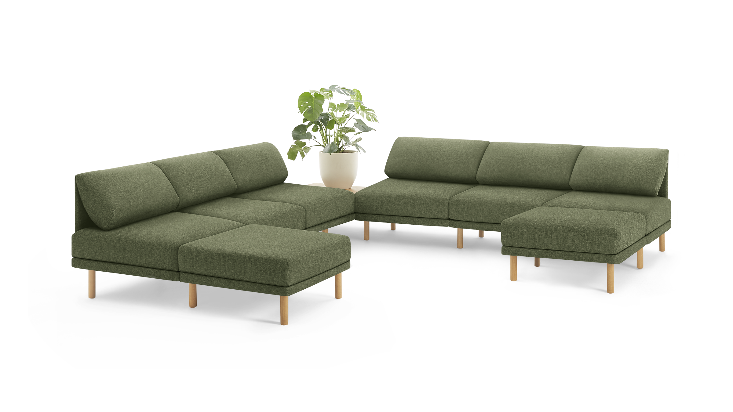 modern olive green fabric sectional sofa with wooden legs and matching ottoman, featuring a plant in a modern design