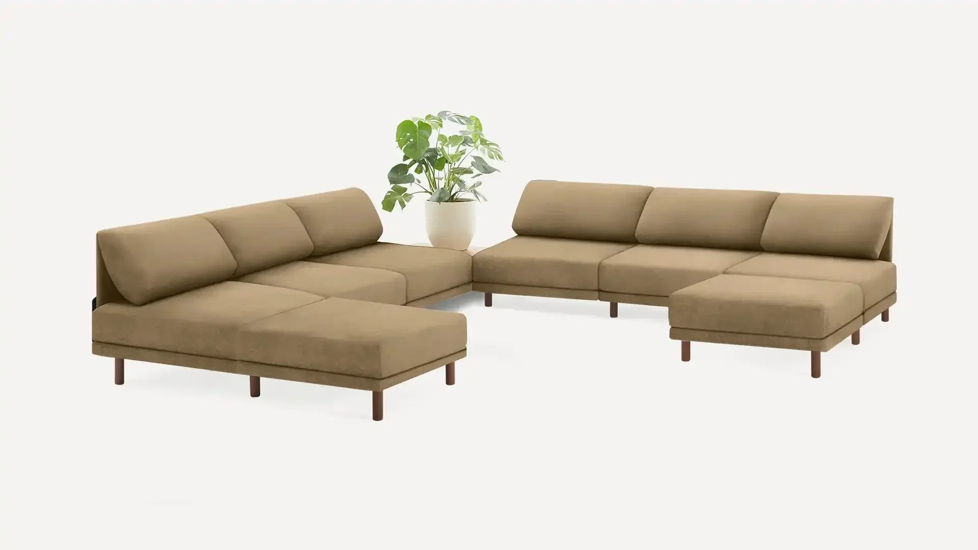 modern sectional sofa with beige fabric upholster and wooden legs, featuring a large cushioned backrest, and a matching ottoman