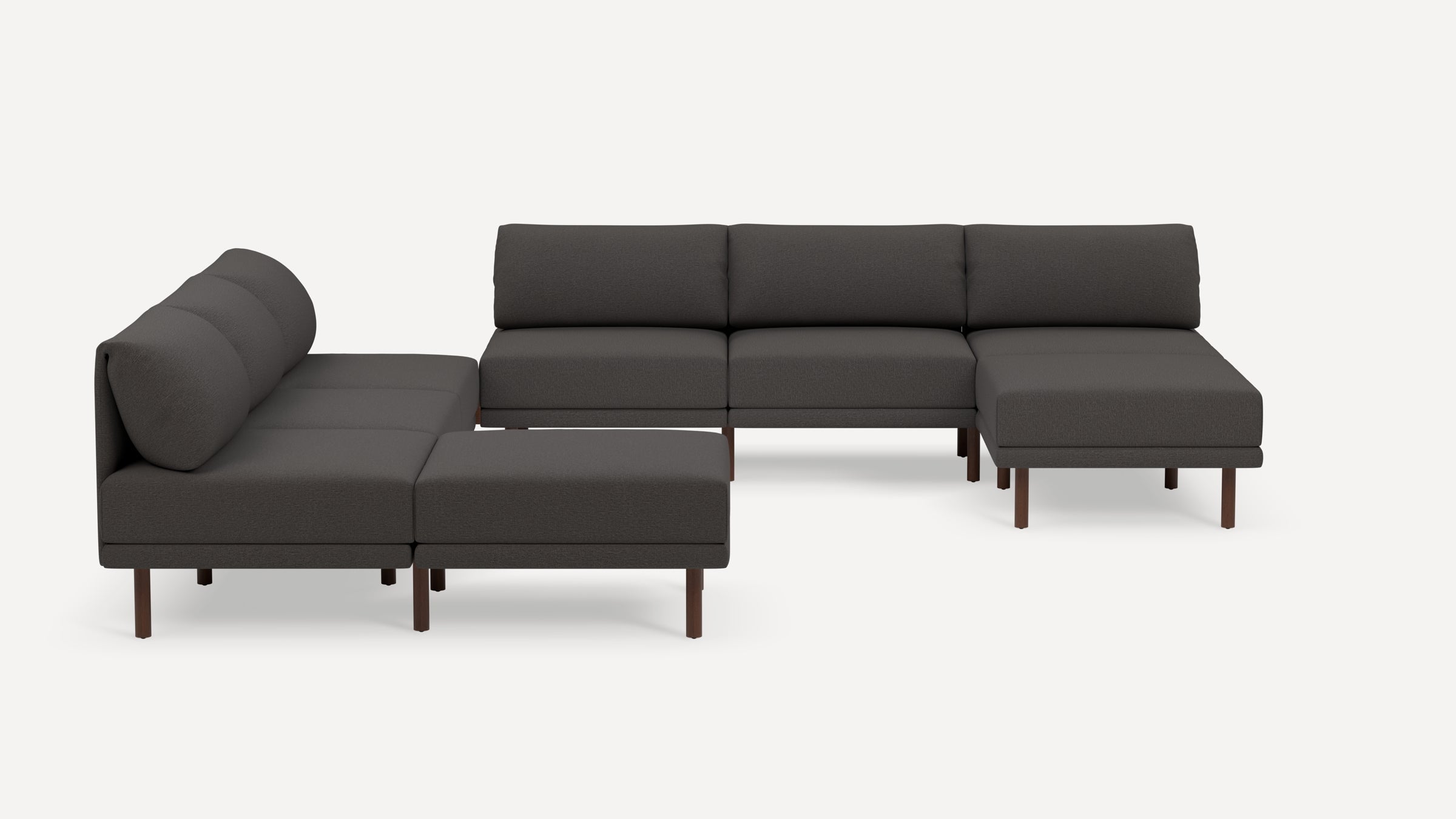 Dark gray L-shaped sectional sofa with plush cushions and wooden legs, featuring a modern minimalist design.