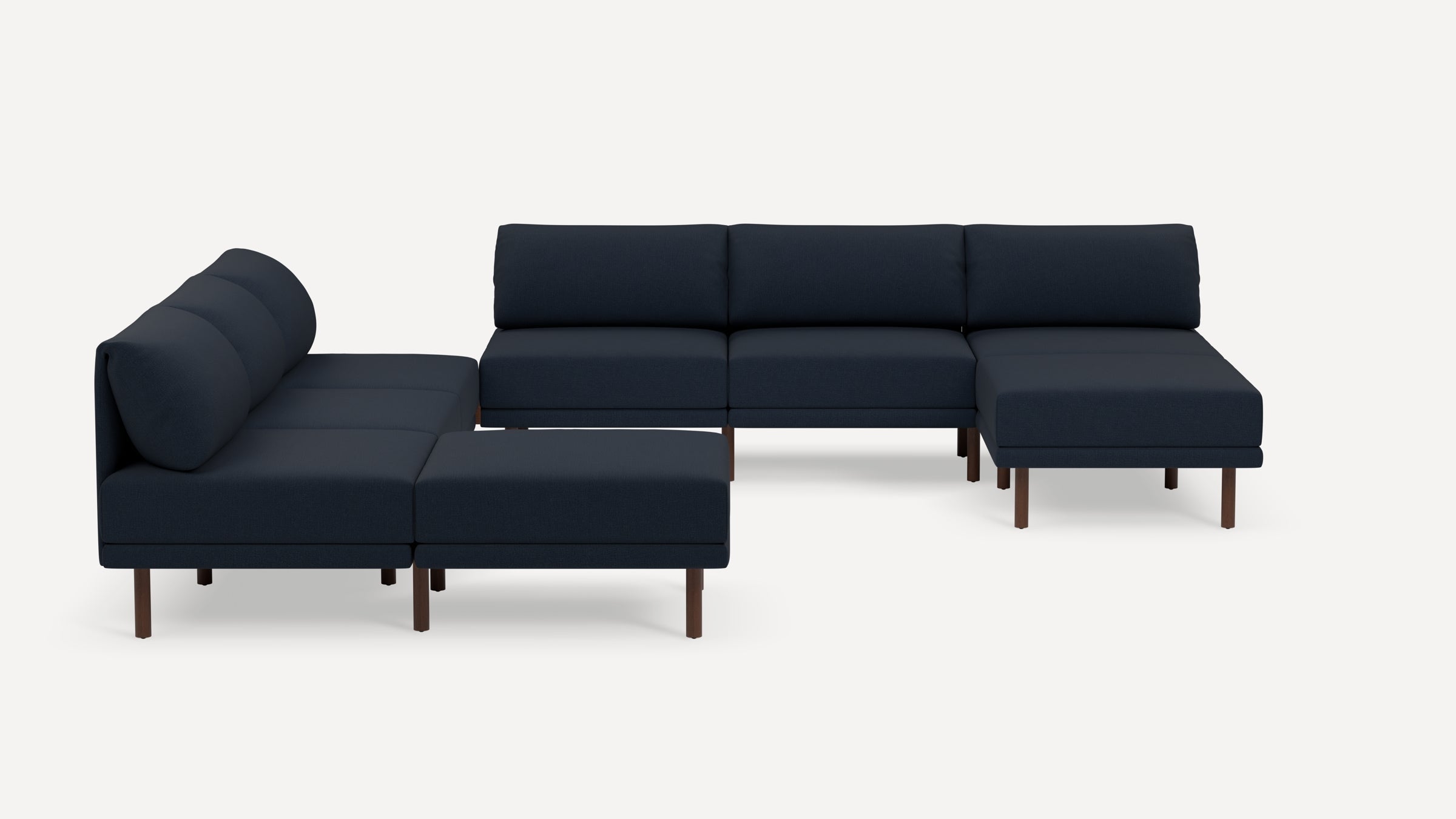 Modern navy blue sectional sofa with wooden legs, featuring cushioned seats and backrests arranged in an L-shape.