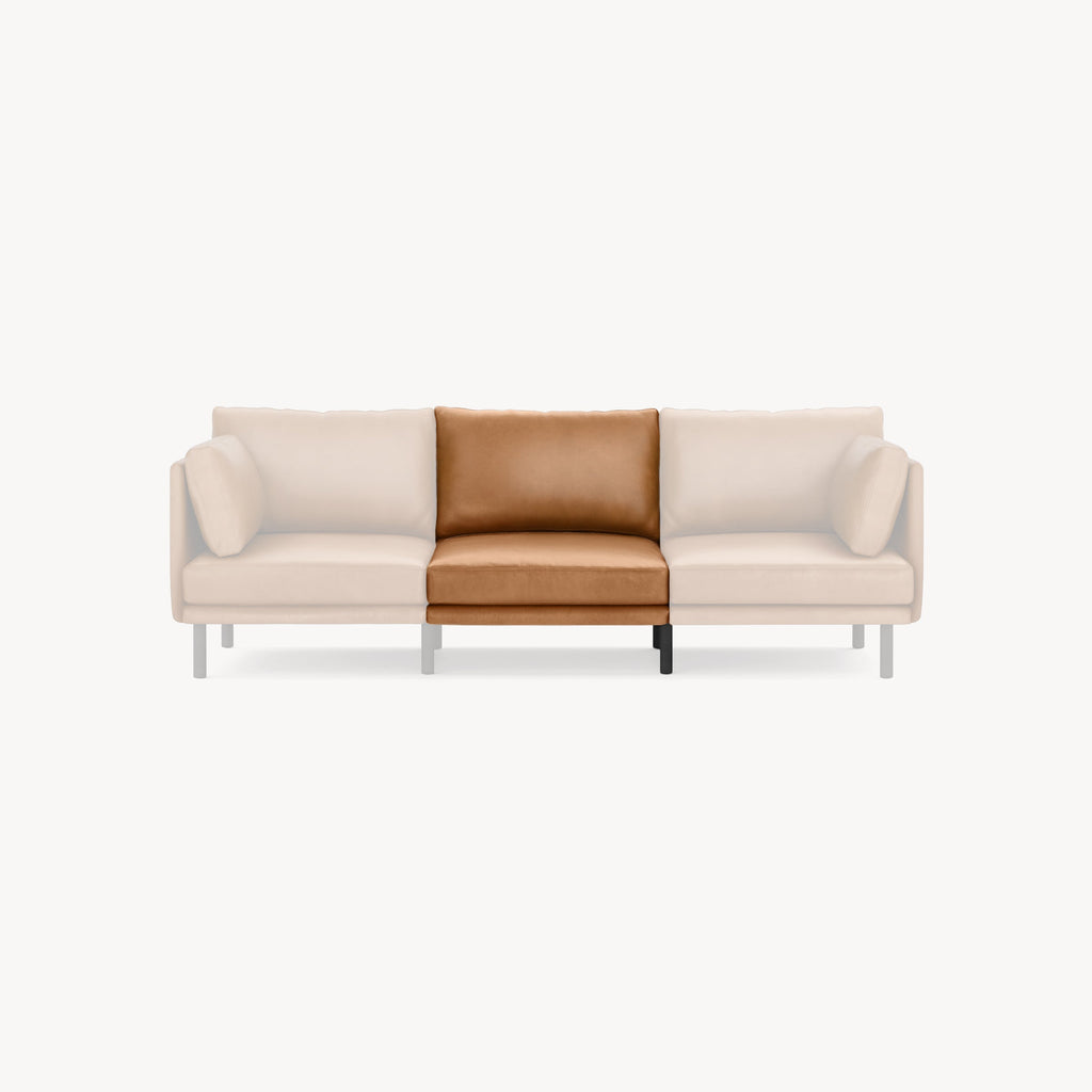 Front view of a modern sofa with a central seat cushion in tan leather and the surrounding cushions in light beige fabric.
