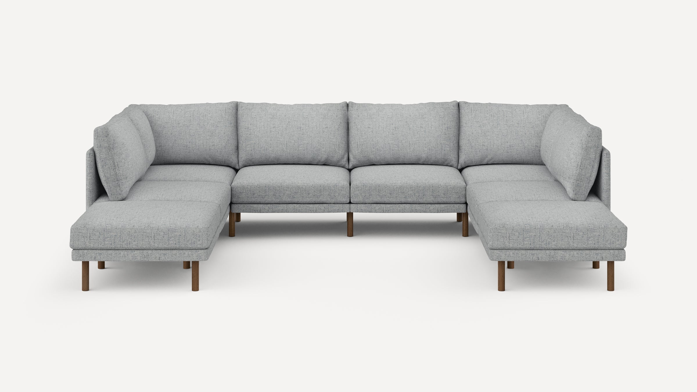 Modern light gray fabric U-shaped sectional sofa with wooden legs, featuring plush back and seat cushions.