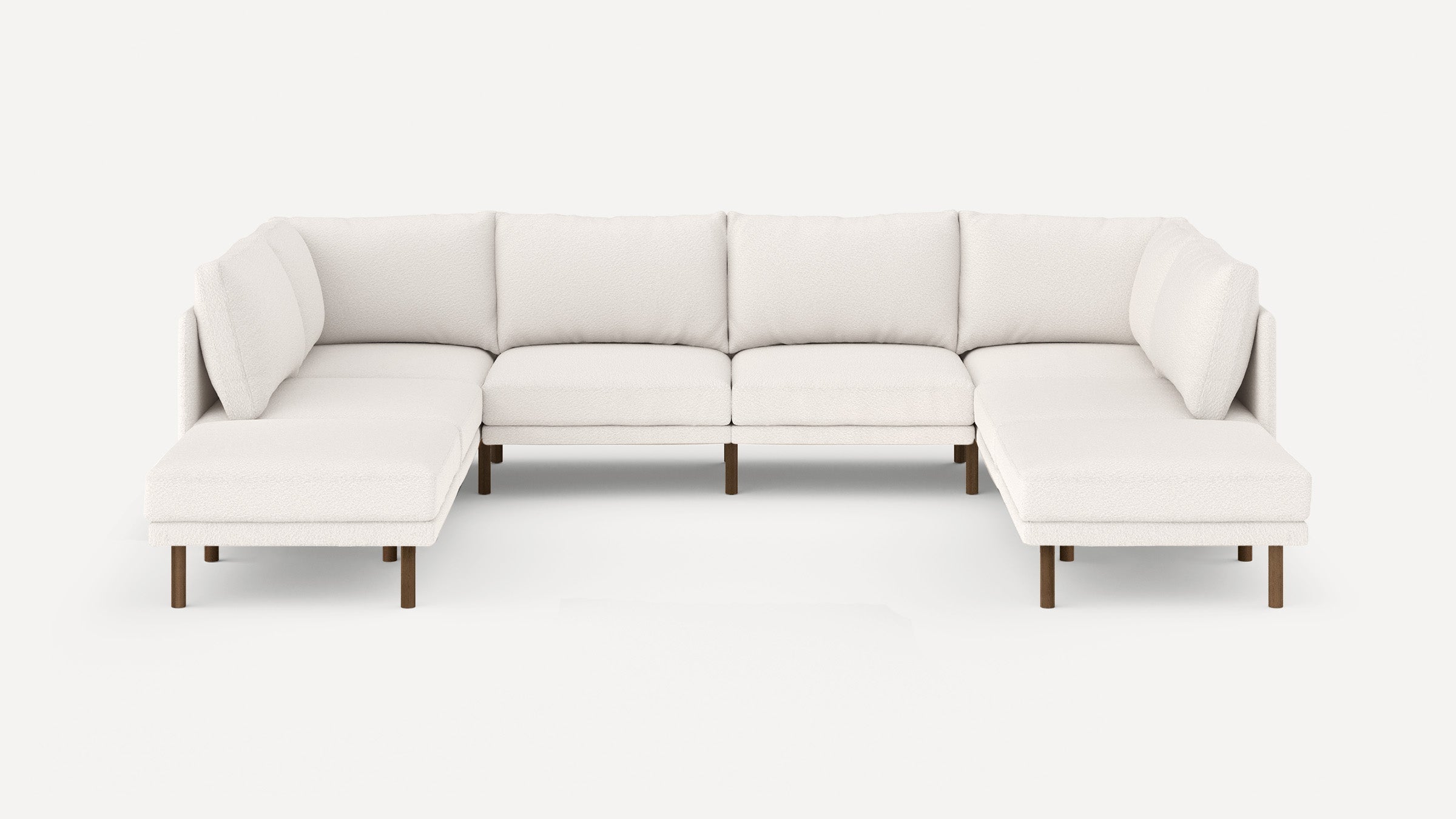 Large modern U-shaped sectional sofa in white fabric with wooden legs, featuring cushioned seats and backrests.