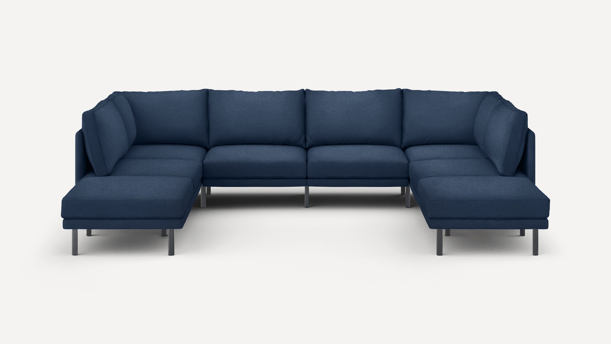 Modern navy blue U-shaped sectional sofa with plush cushions and metal legs on a white background.