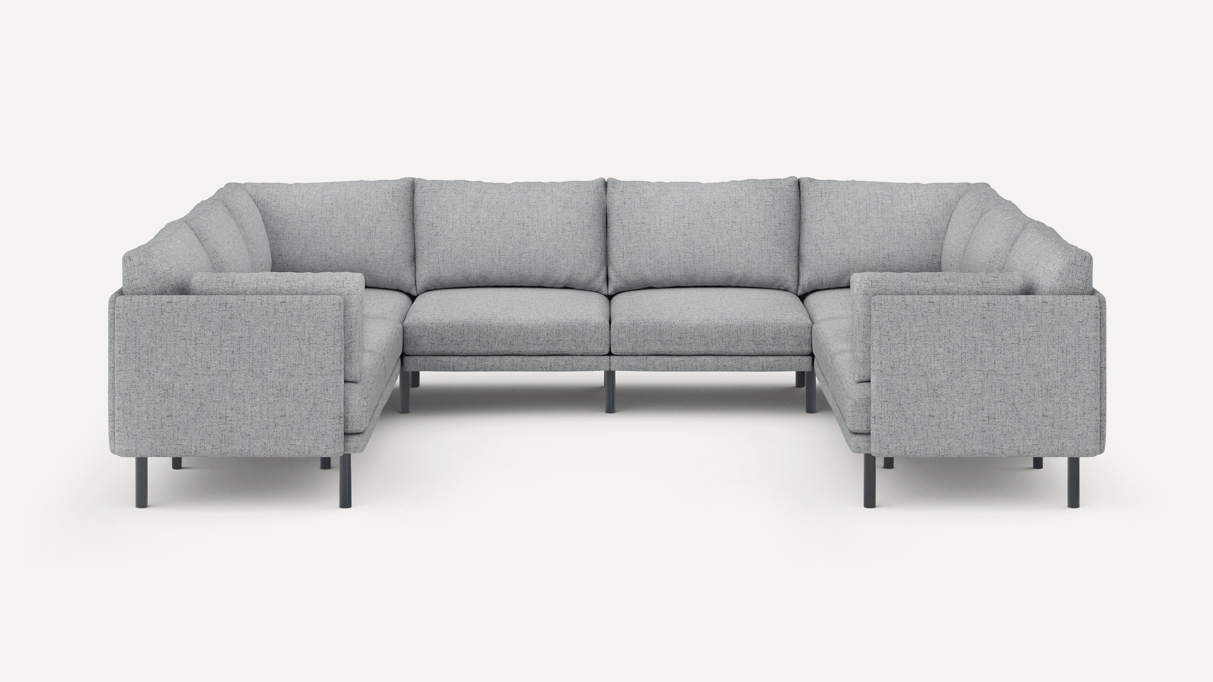 Light gray fabric sectional sofa with clean lines, plush cushions, and slim black metal legs, arranged in a U-shape.