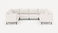 White L-shaped sectional sofa with plush cushions and dark wooden legs, set against a plain light background.