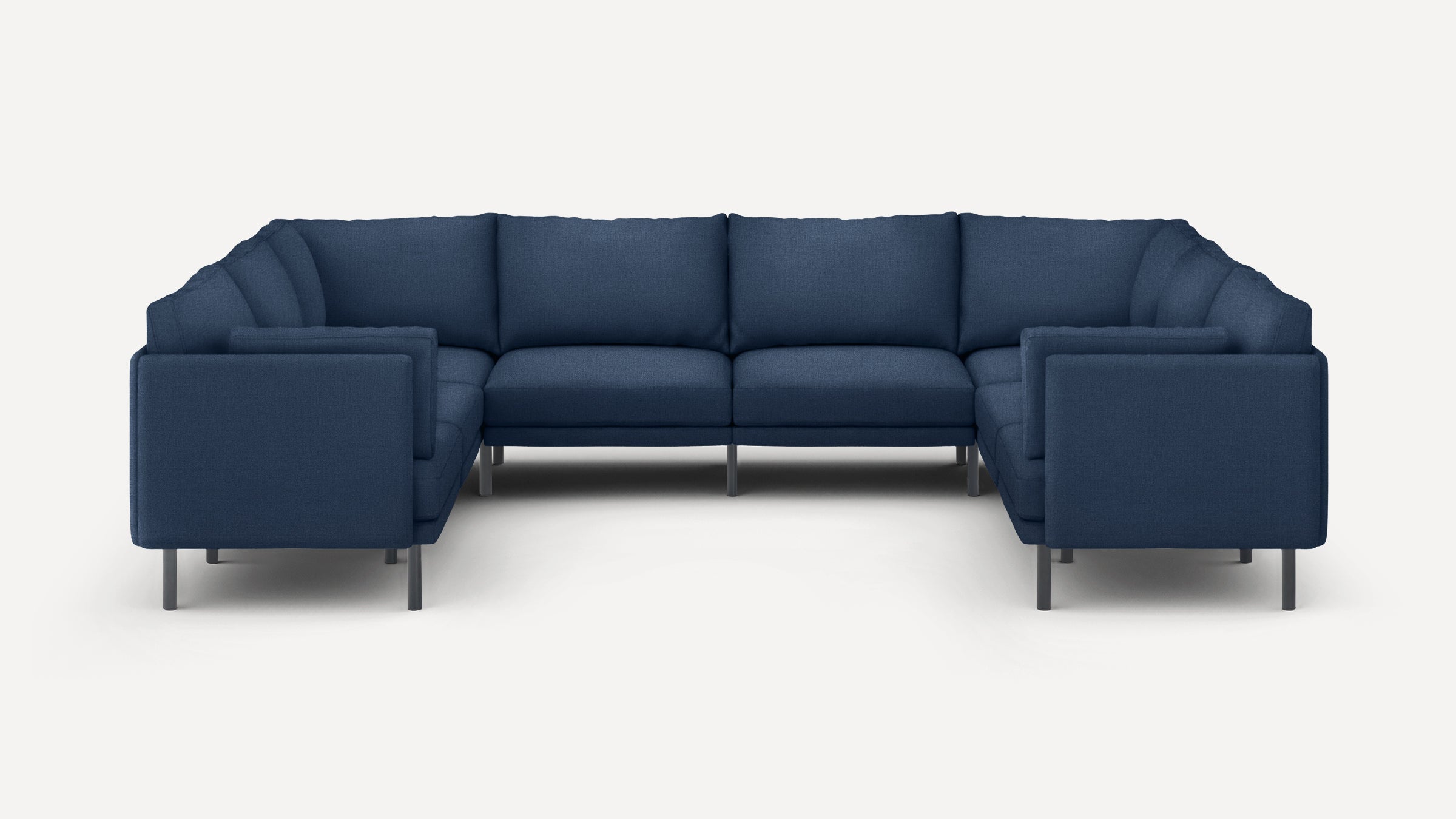 Modern U-shaped sectional sofa with dark blue fabric upholstery and slim metal legs, featuring cushioned seats and backrests.