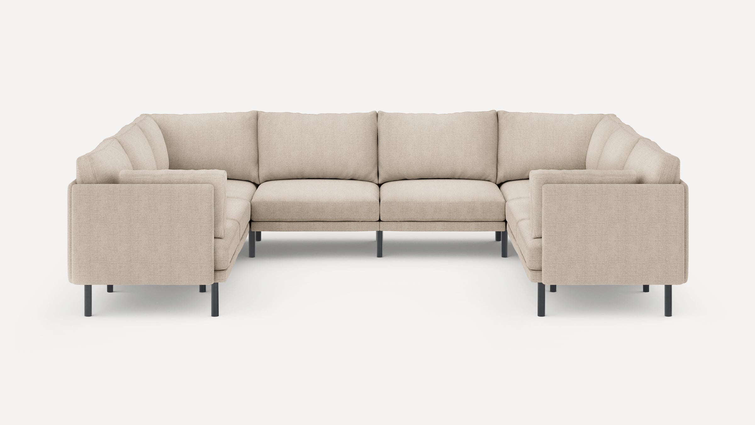 Beige fabric sectional sofa with modern design, clean lines, and black metal legs, arranged in a U-shape.