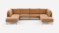 Large modern U-shaped sectional sofa with caramel leather upholstery and wooden legs on a plain white background.