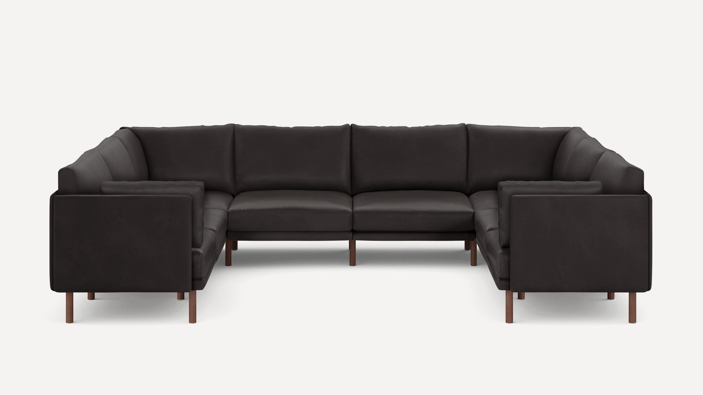 Modern dark brown leather U-shaped sectional sofa with clean lines and wooden legs on white background.