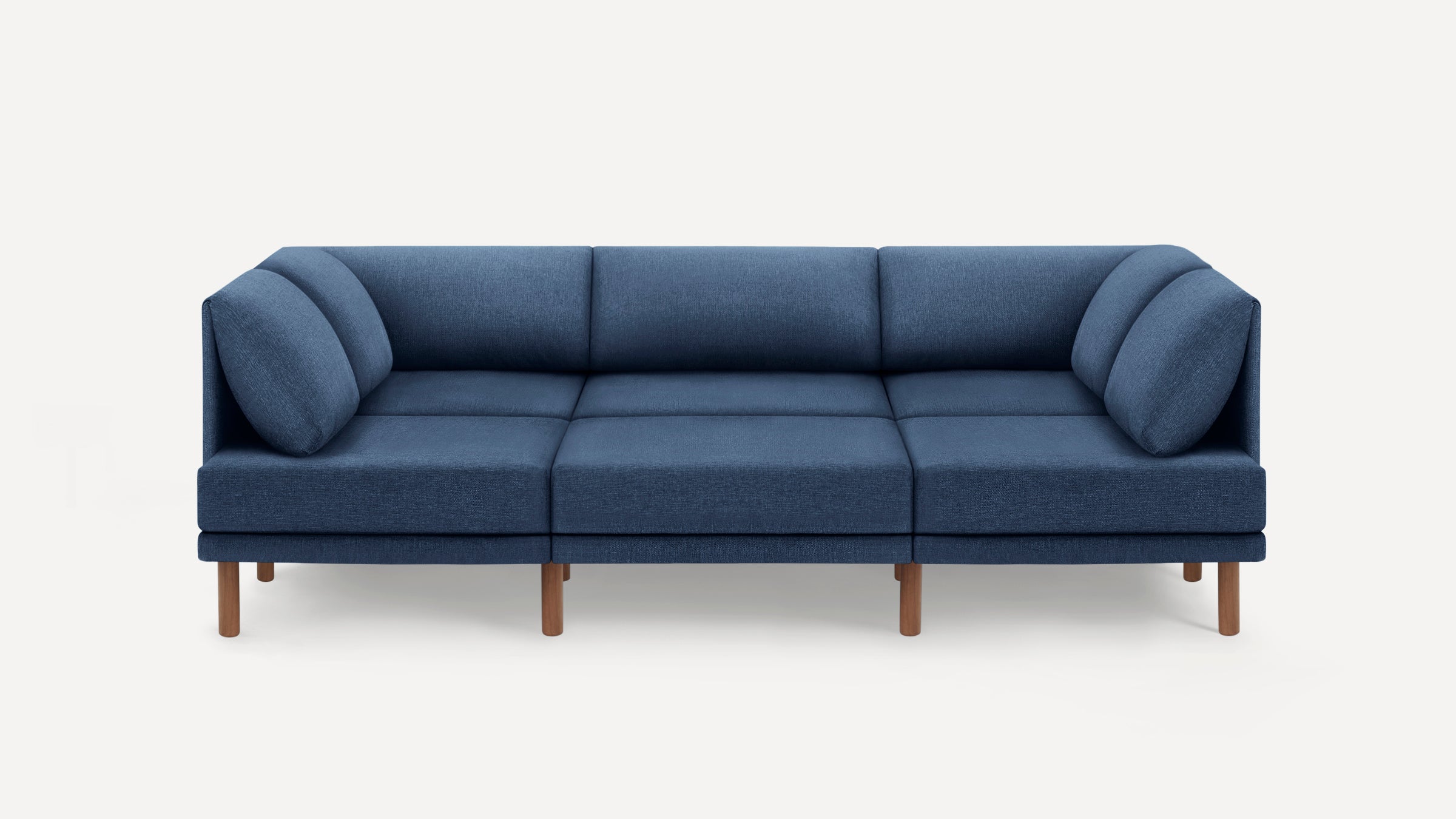 Modern three-seater blue fabric sofa with wooden legs, featuring a minimalist design and plush cushions.