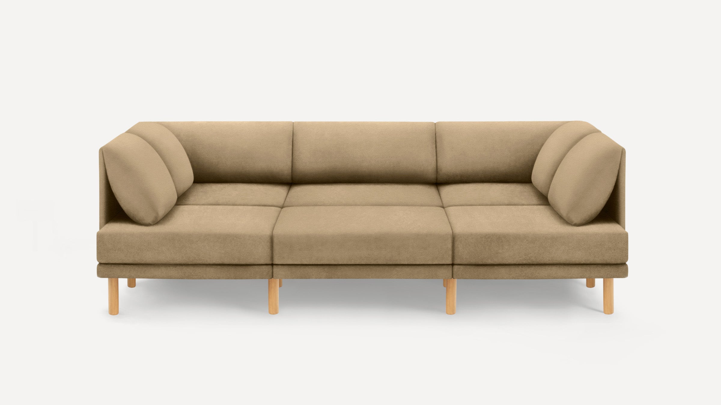 Modern beige three-seater sofa with rounded cushions and light wooden legs, set against a plain light background.