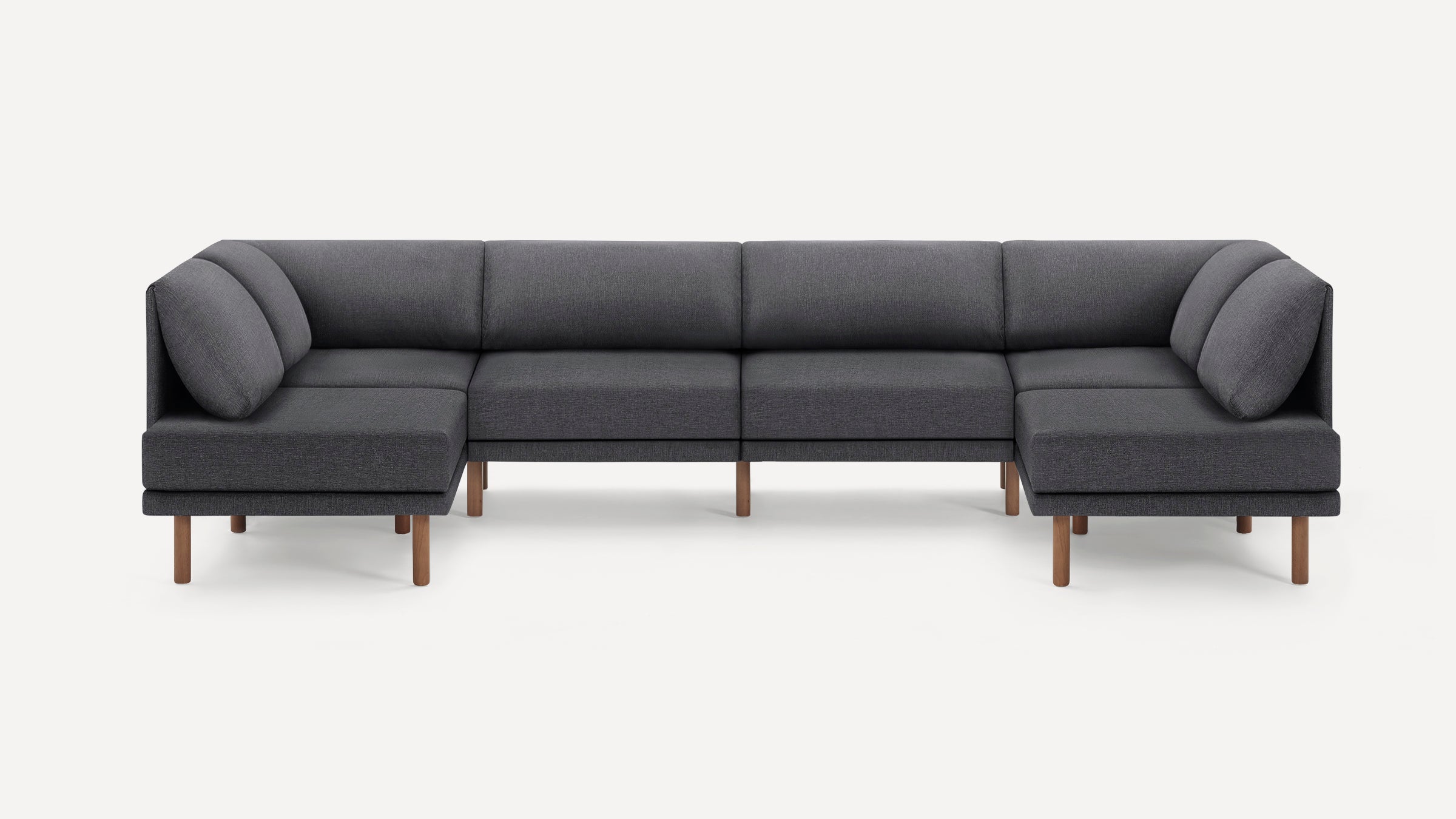 Modern dark gray fabric sectional sofa with wooden legs, featuring clean lines and plush back cushions.
