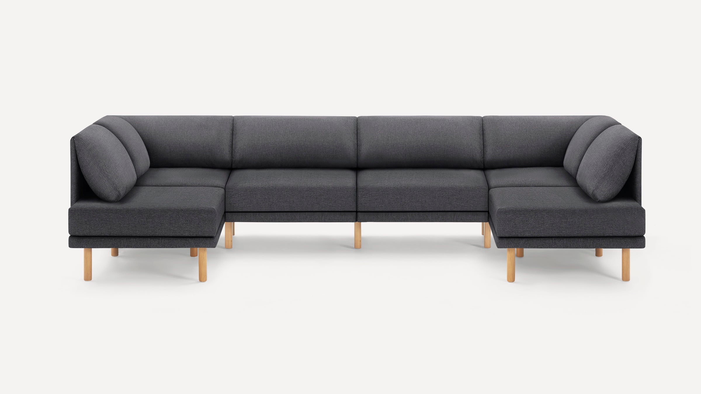 Dark gray fabric sectional sofa with wooden legs, featuring an L-shape design and cushioned backrests.