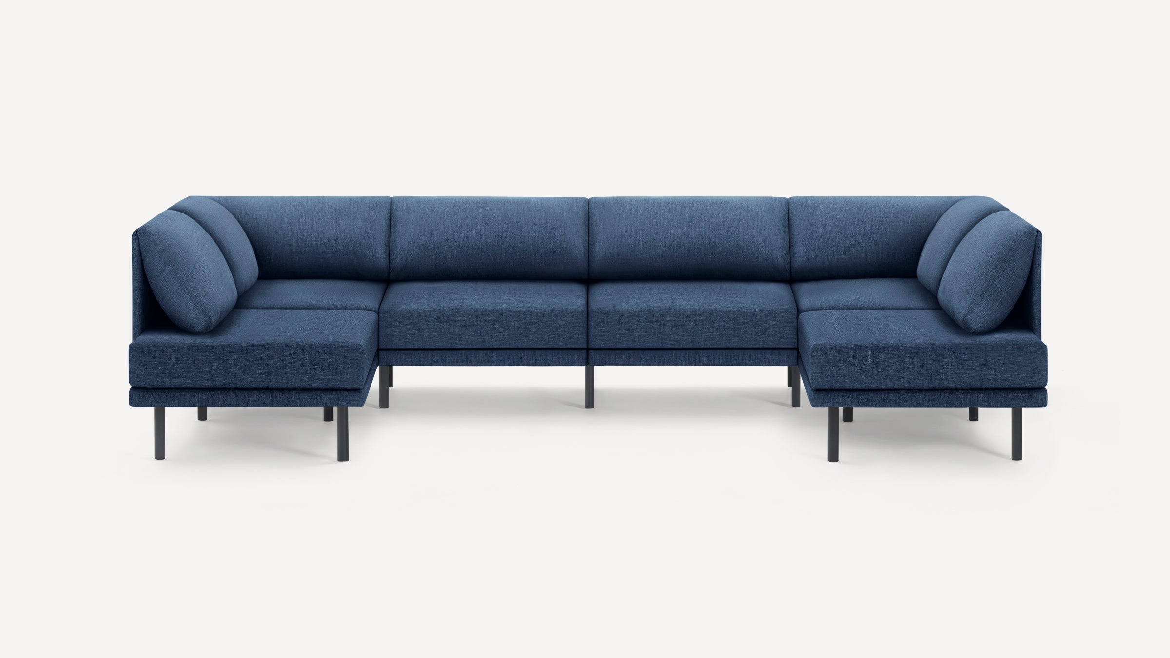 Modern modular sectional sofa in deep blue fabric with clean lines, metal legs, and cushioned backrest, designed for spacious seating.