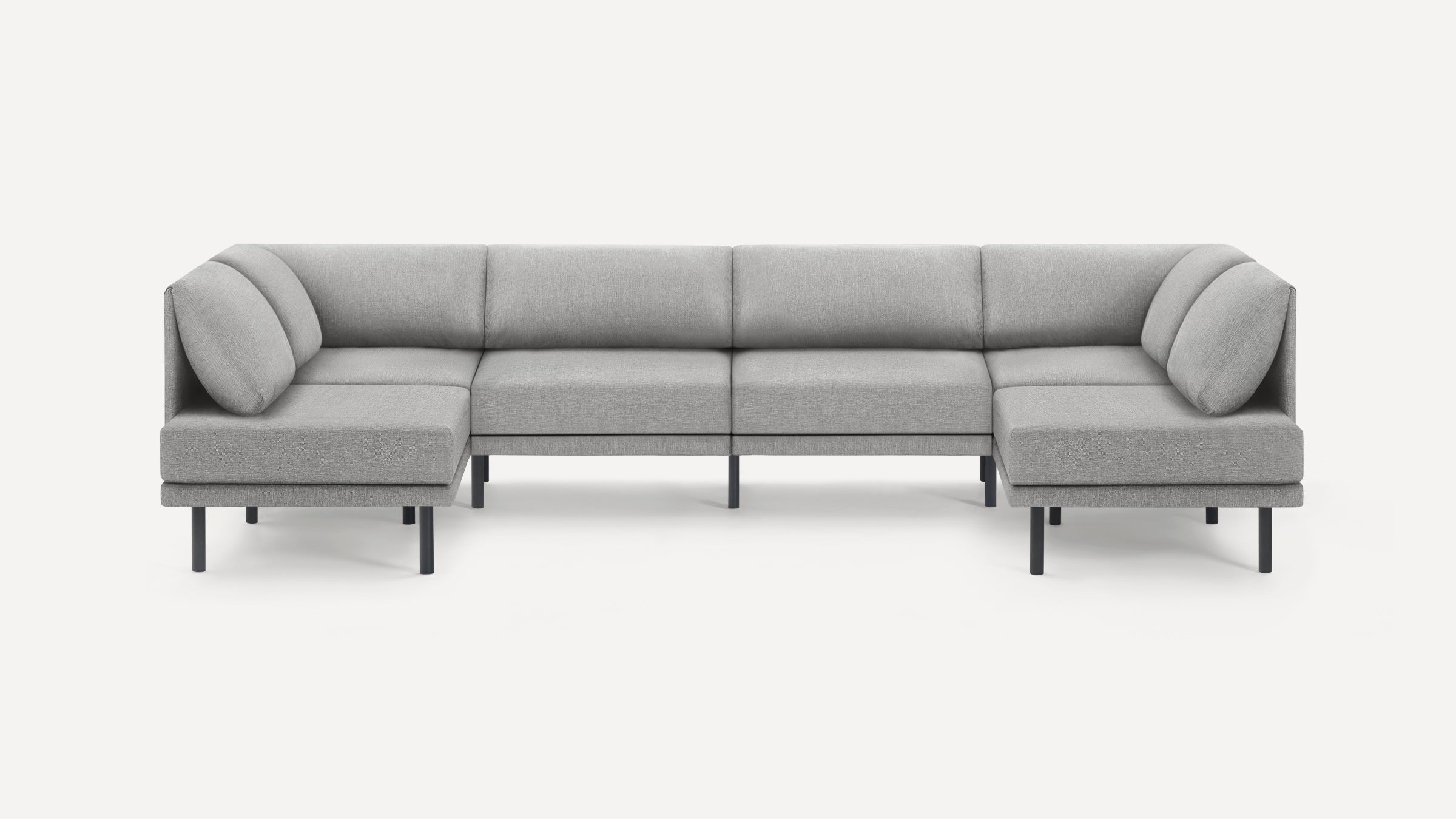 Modern light gray fabric U-shaped sectional sofa with slim black legs and cushioned backrests on a white background.