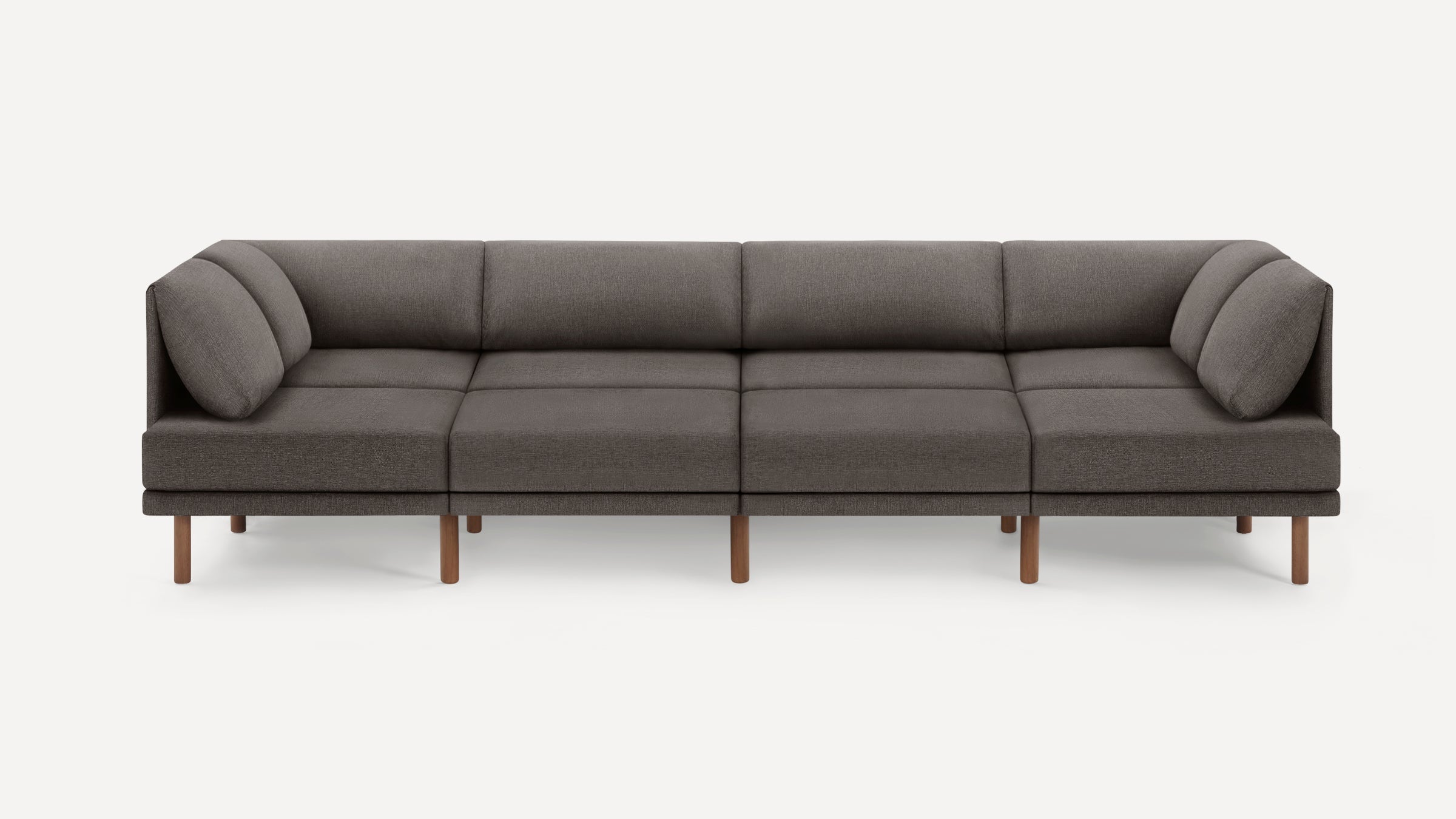 Modern sectional sofa with gray fabric upholstery, wooden legs, and cushioned backrest and armrests, designed for spacious seating.